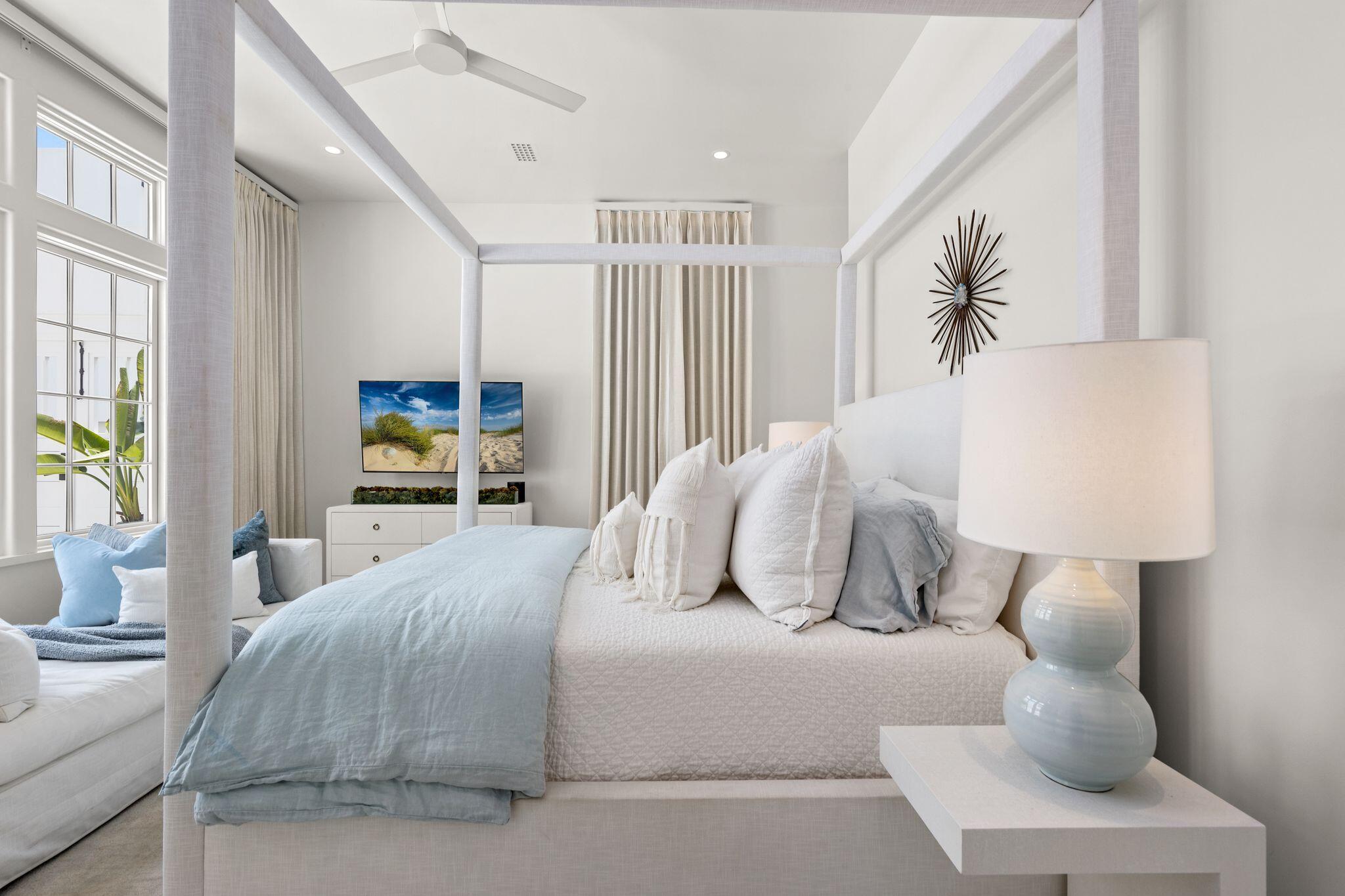 89 Kaiya Avenue Inlet Beach, FL 32461 - Photo 32 of 82 a bedroom with a large bed and a potted plant