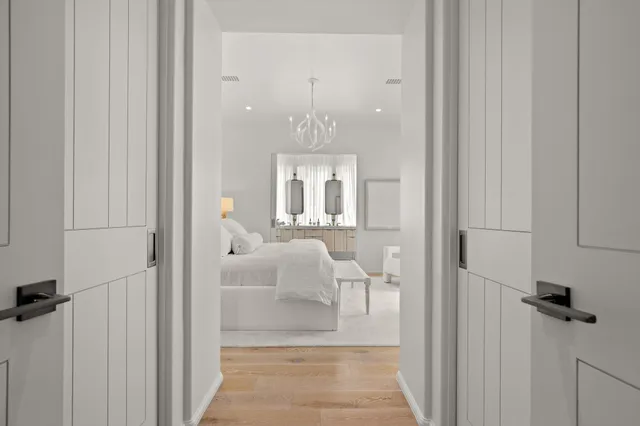 a spacious bedroom with a bed a couch and a window