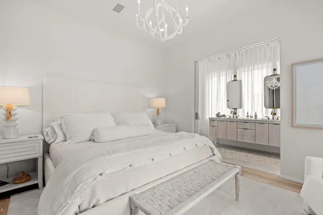 a bedroom with a bed and a night stand