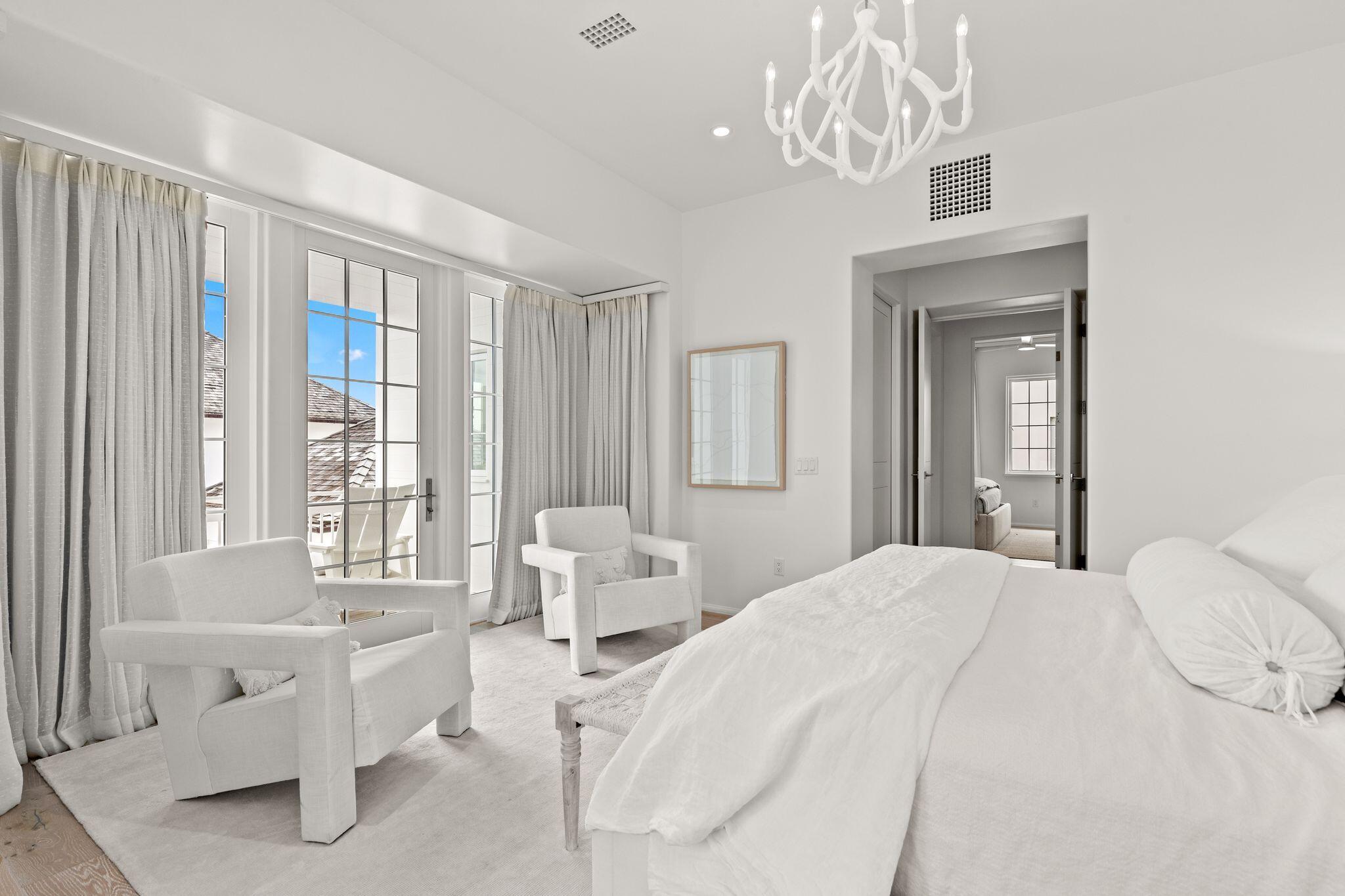 89 Kaiya Avenue Inlet Beach, FL 32461 - Photo 46 of 82 a spacious bedroom with a bed and a large window