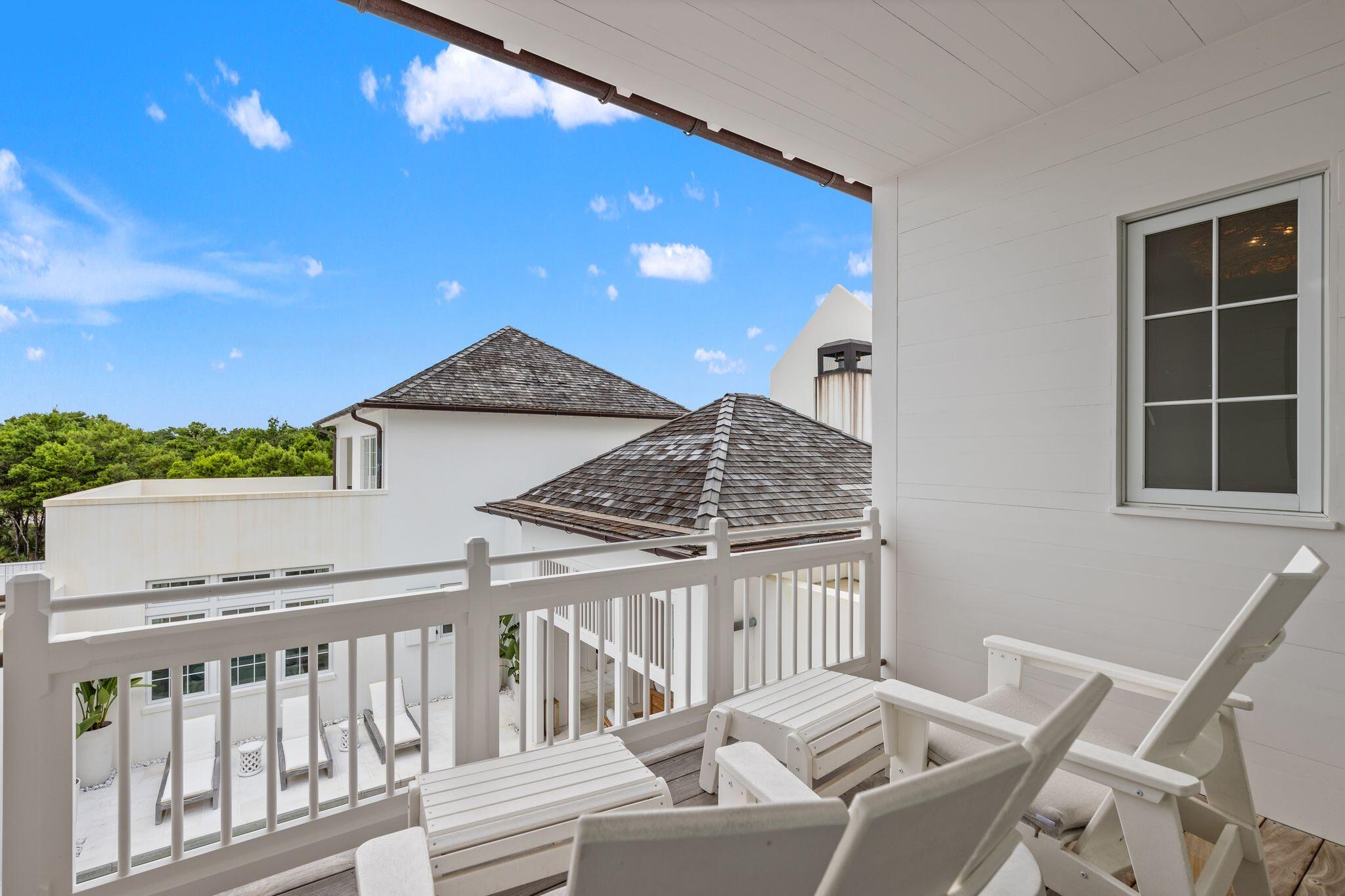 89 Kaiya Avenue Inlet Beach, FL 32461 - Photo 50 of 82 a view of a house with a balcony and wooden floor