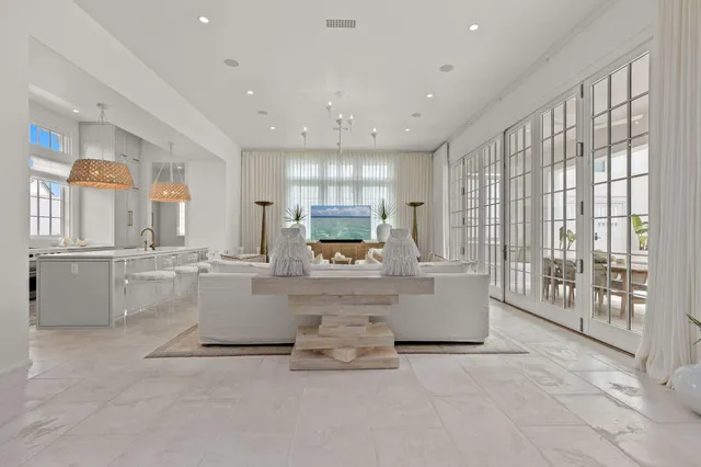 a living room with a couch and a large window