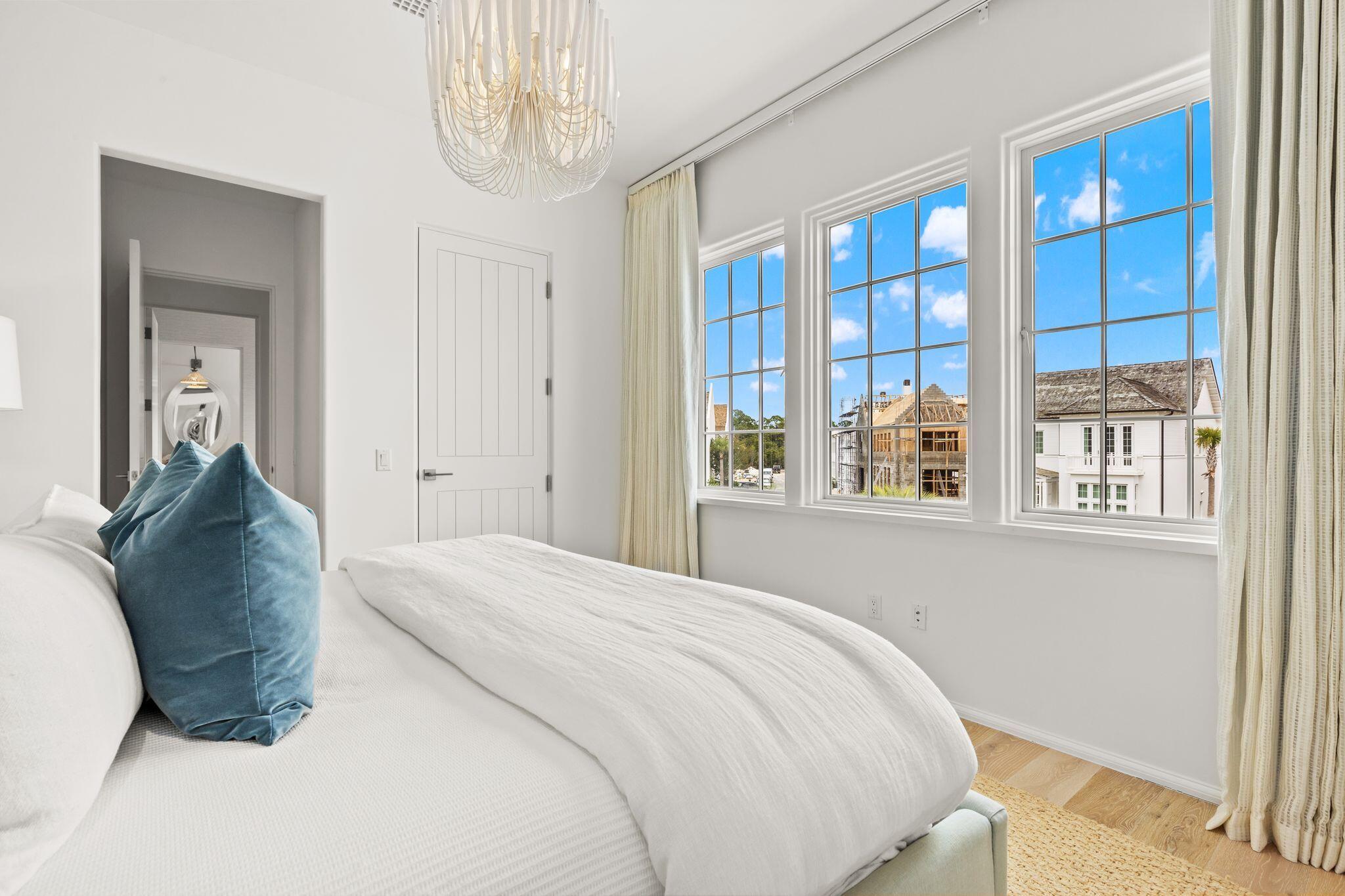 89 Kaiya Avenue Inlet Beach, FL 32461 - Photo 59 of 82 a spacious bedroom with a bed and a window