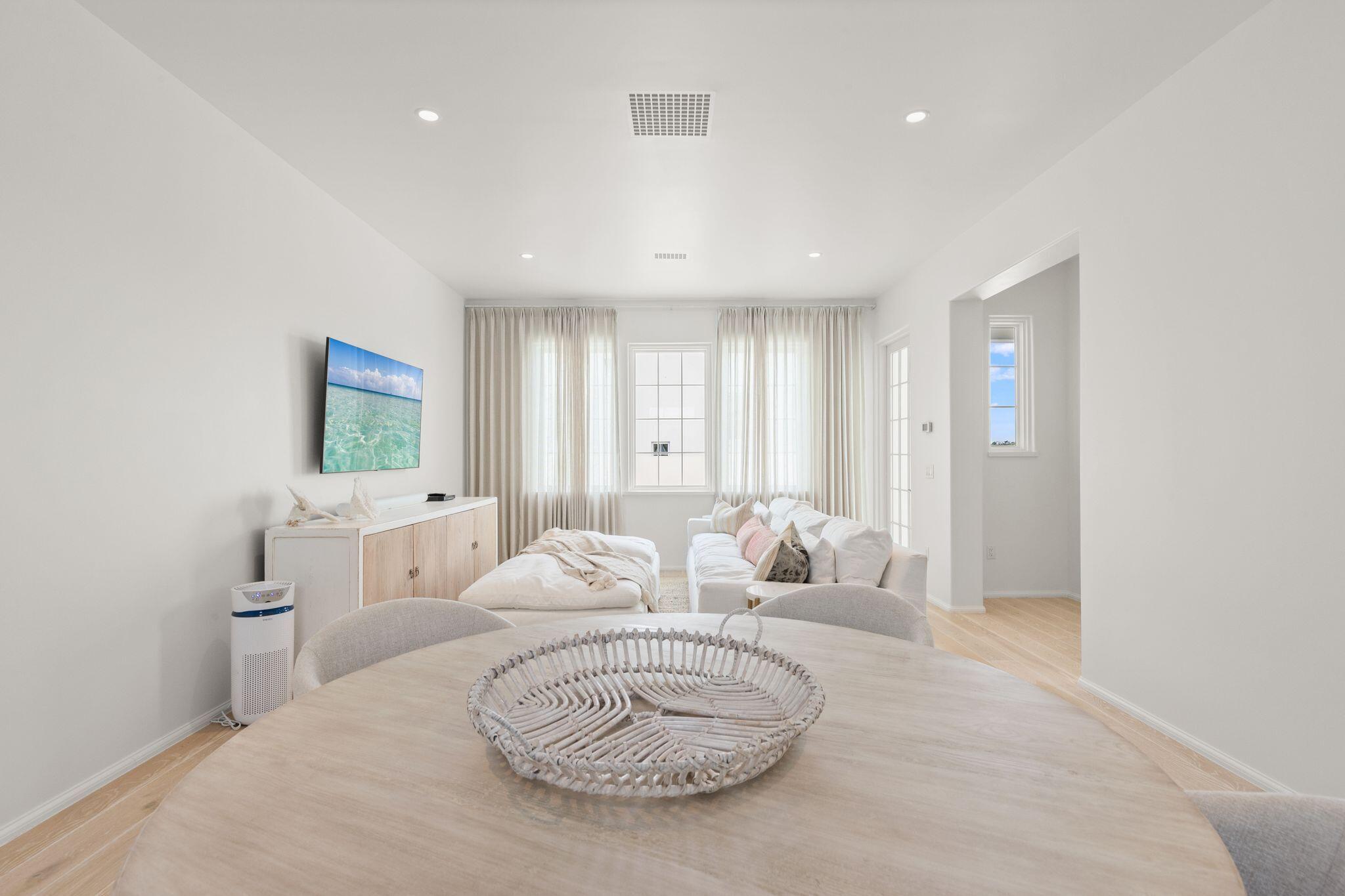 89 Kaiya Avenue Inlet Beach, FL 32461 - Photo 66 of 82 a spacious bedroom with a bed a couch and a window