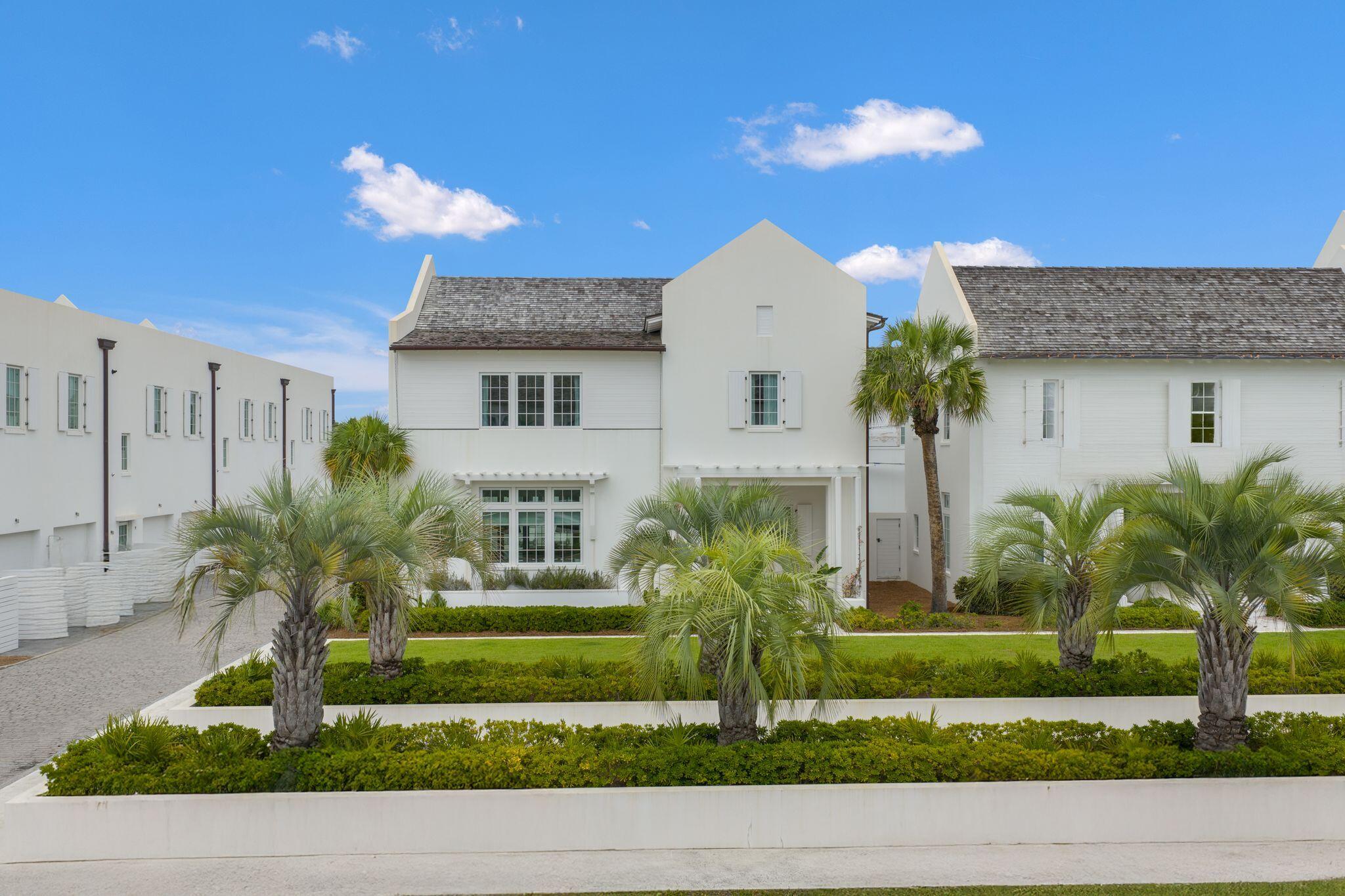 89 Kaiya Avenue Inlet Beach, FL 32461 - Photo 75 of 82 a front view of a house with a yard and potted plants