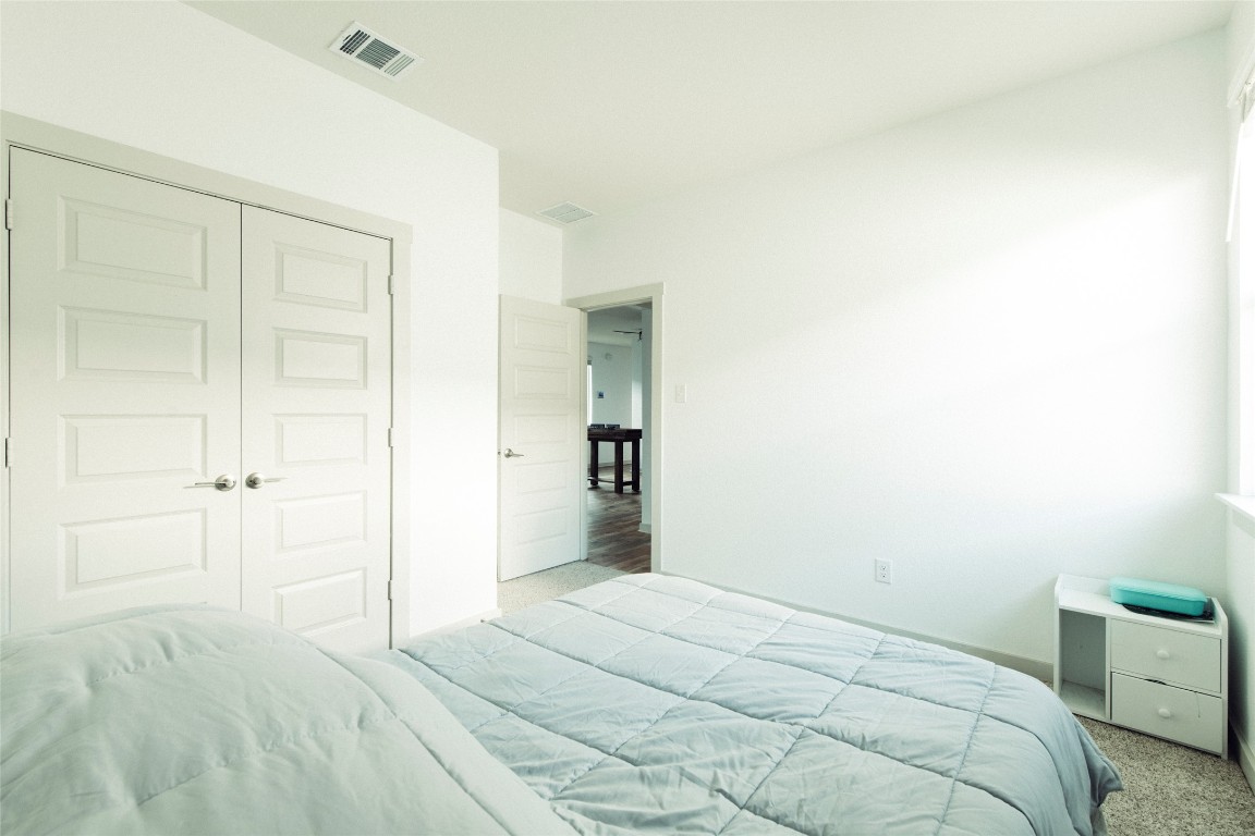 324 Millbrook Boulevard San Marcos, TX 78666 - Photo 13 of 29 a bedroom with a bed and a cabinets