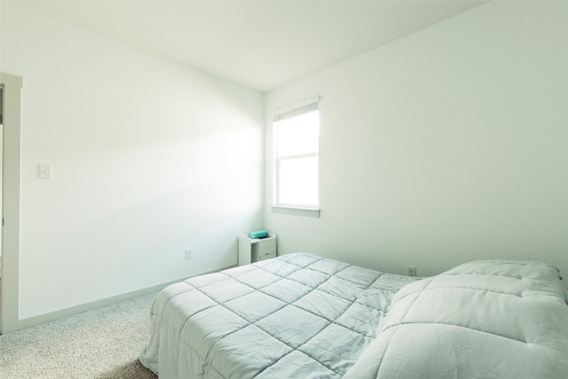 324 Millbrook Boulevard San Marcos, TX 78666 - Photo 14 of 29 a bedroom with a bed and a window