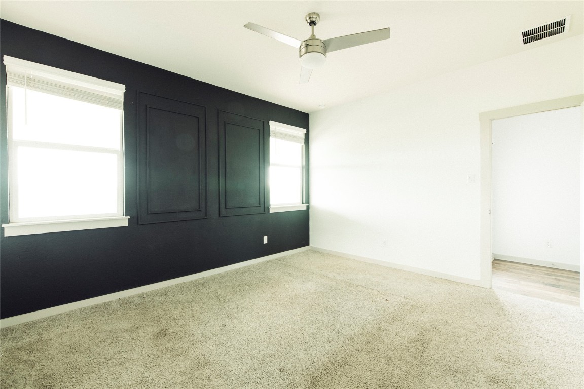 324 Millbrook Boulevard San Marcos, TX 78666 - Photo 19 of 29 an empty room with a window and a ceiling fan