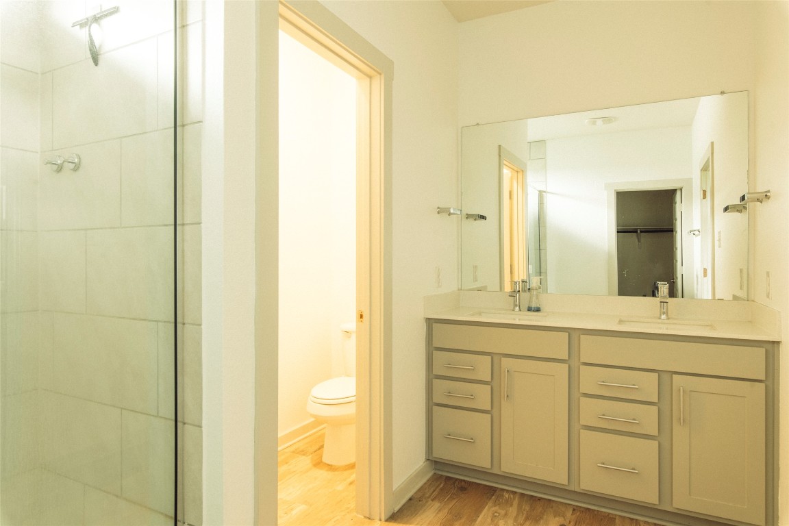 324 Millbrook Boulevard San Marcos, TX 78666 - Photo 21 of 29 a bathroom with a double vanity sink and a mirror