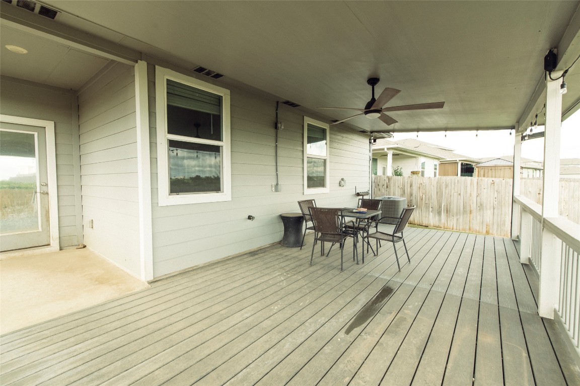 324 Millbrook Boulevard San Marcos, TX 78666 - Photo 26 of 29 a view of a patio with table and chairs with wooden floor and fence