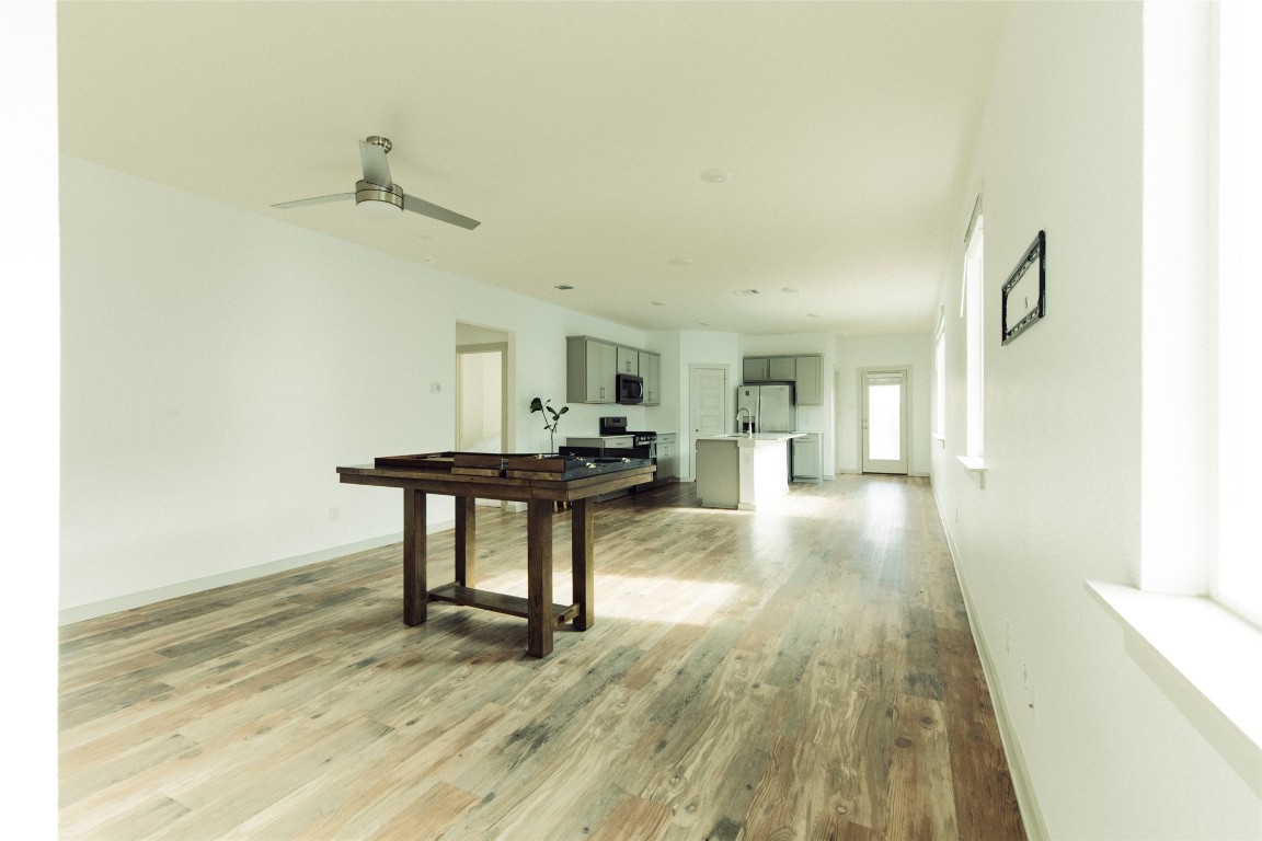 324 Millbrook Boulevard San Marcos, TX 78666 - Photo 6 of 29 a view of a room with wooden floor and furniture