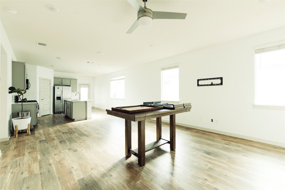 324 Millbrook Boulevard San Marcos, TX 78666 - Photo 7 of 29 a room with furniture and a wooden floor