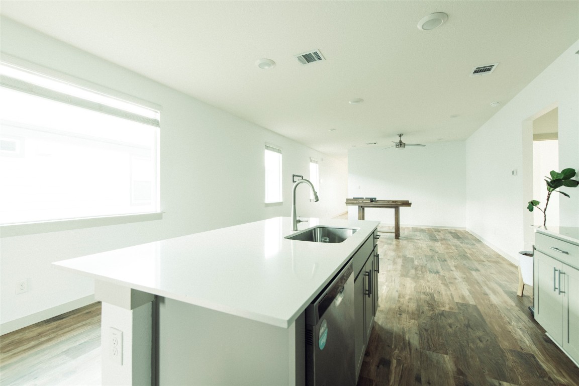 324 Millbrook Boulevard San Marcos, TX 78666 - Photo 9 of 29 a kitchen with a sink a stove and a refrigerator