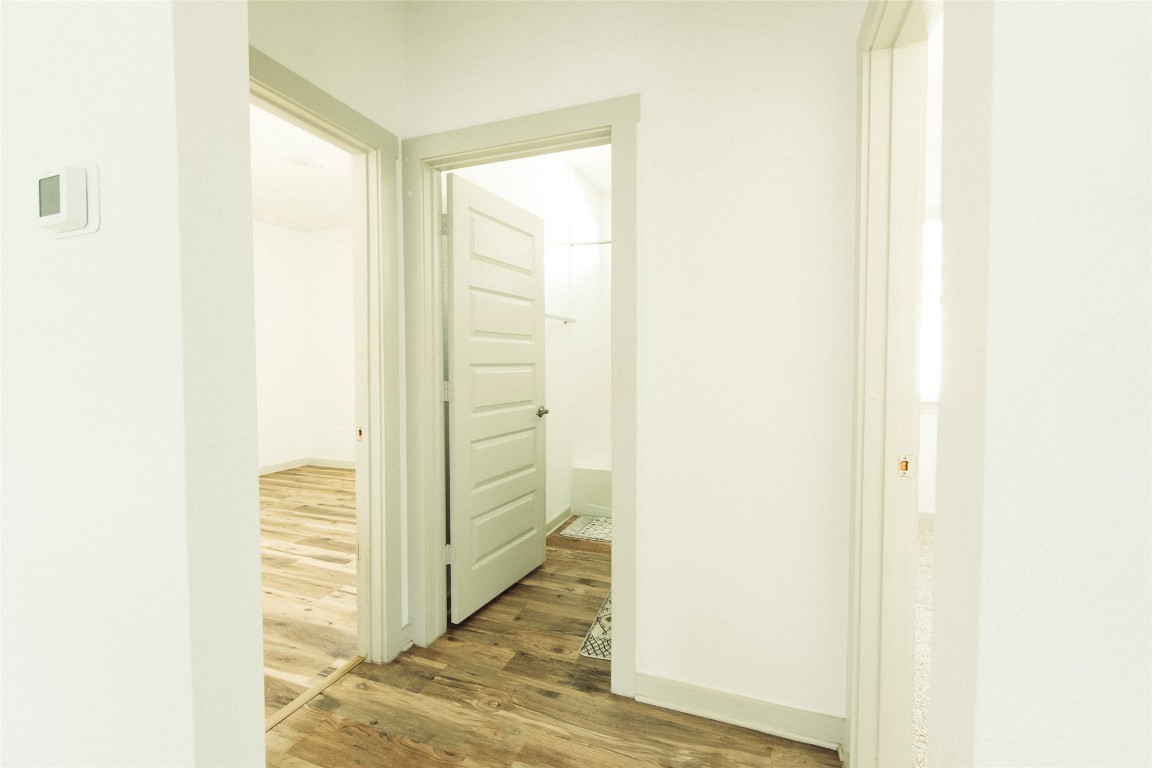 324 Millbrook Boulevard San Marcos, TX 78666 - Photo 10 of 29 a view of a hallway with wooden floor