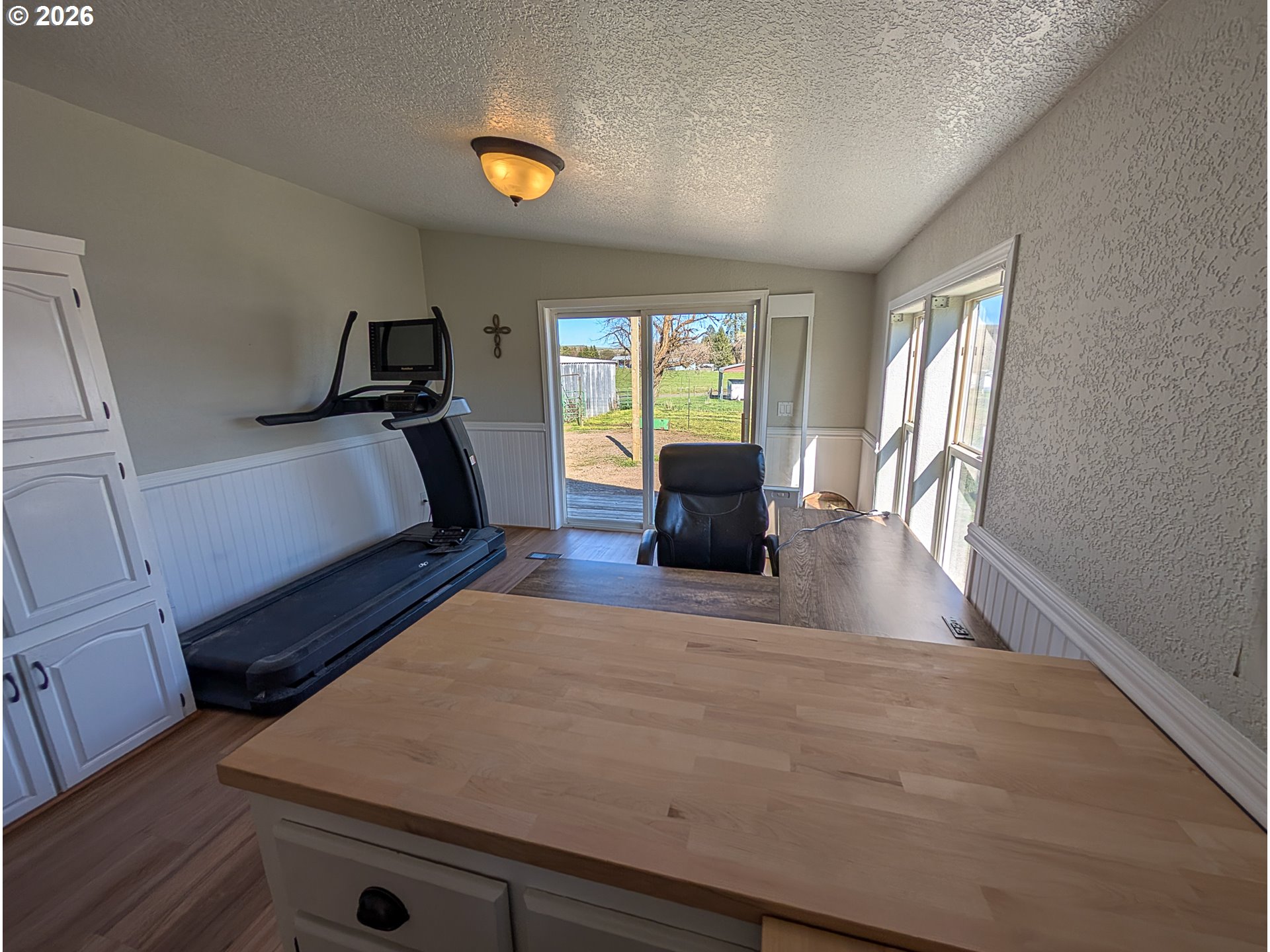 1670 Palmer Street Elgin, OR 97827 - Photo 13 of 41 a living room with furniture and a flat screen tv