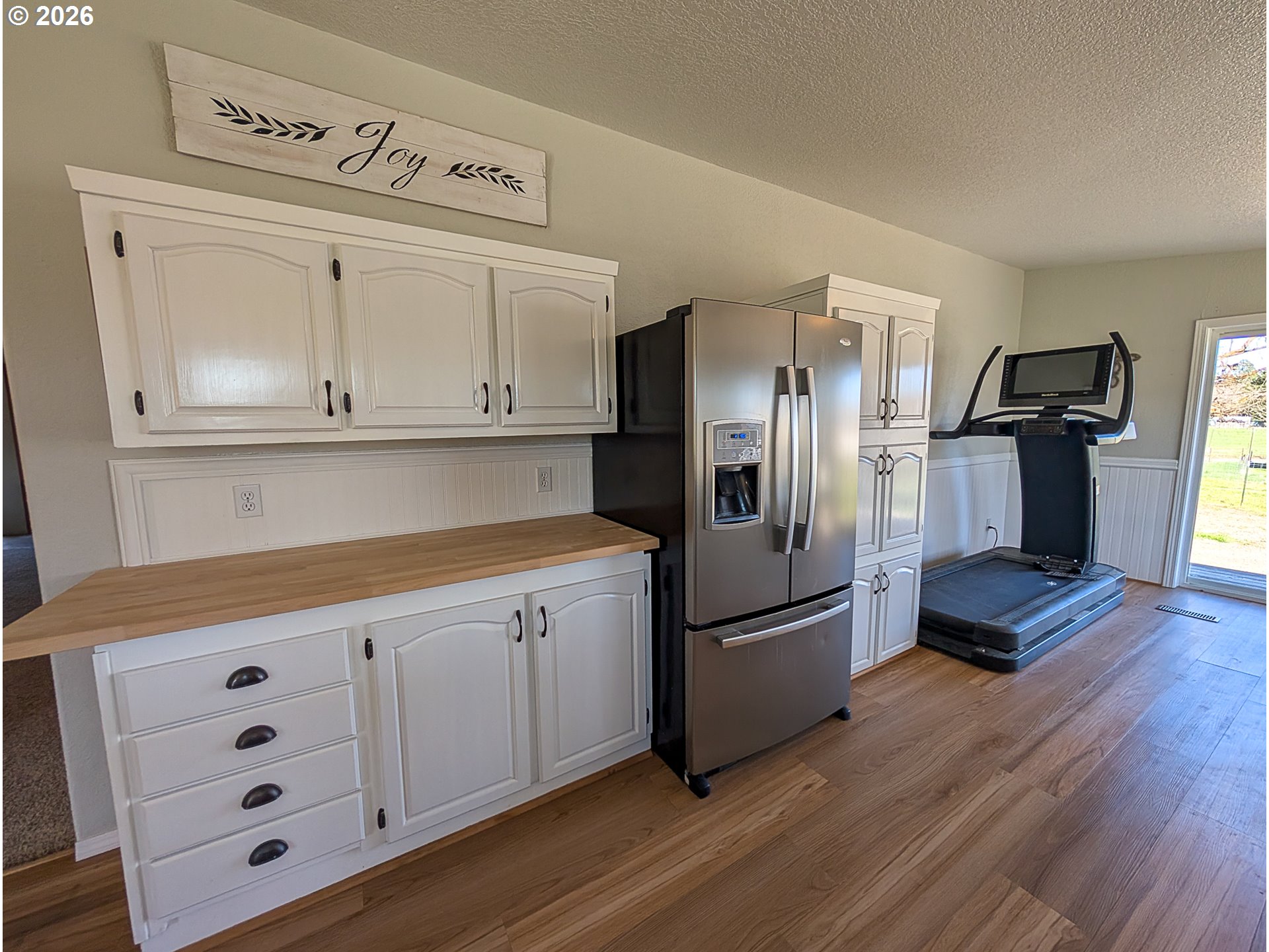 1670 Palmer Street Elgin, OR 97827 - Photo 15 of 41 a kitchen with granite countertop white cabinets and stainless steel appliances