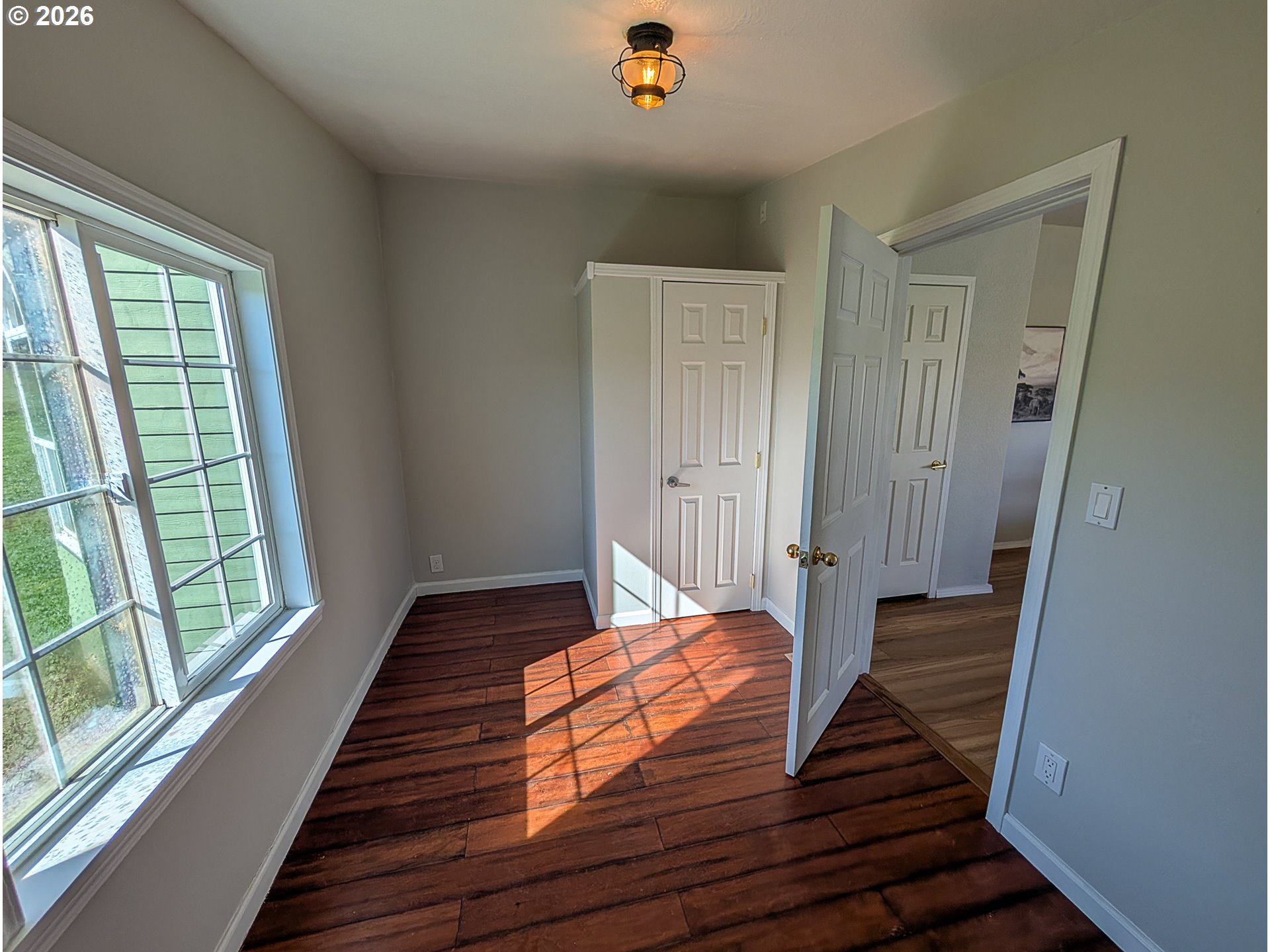 1670 Palmer Street Elgin, OR 97827 - Photo 19 of 41 a view of bedroom with wooden floor and window