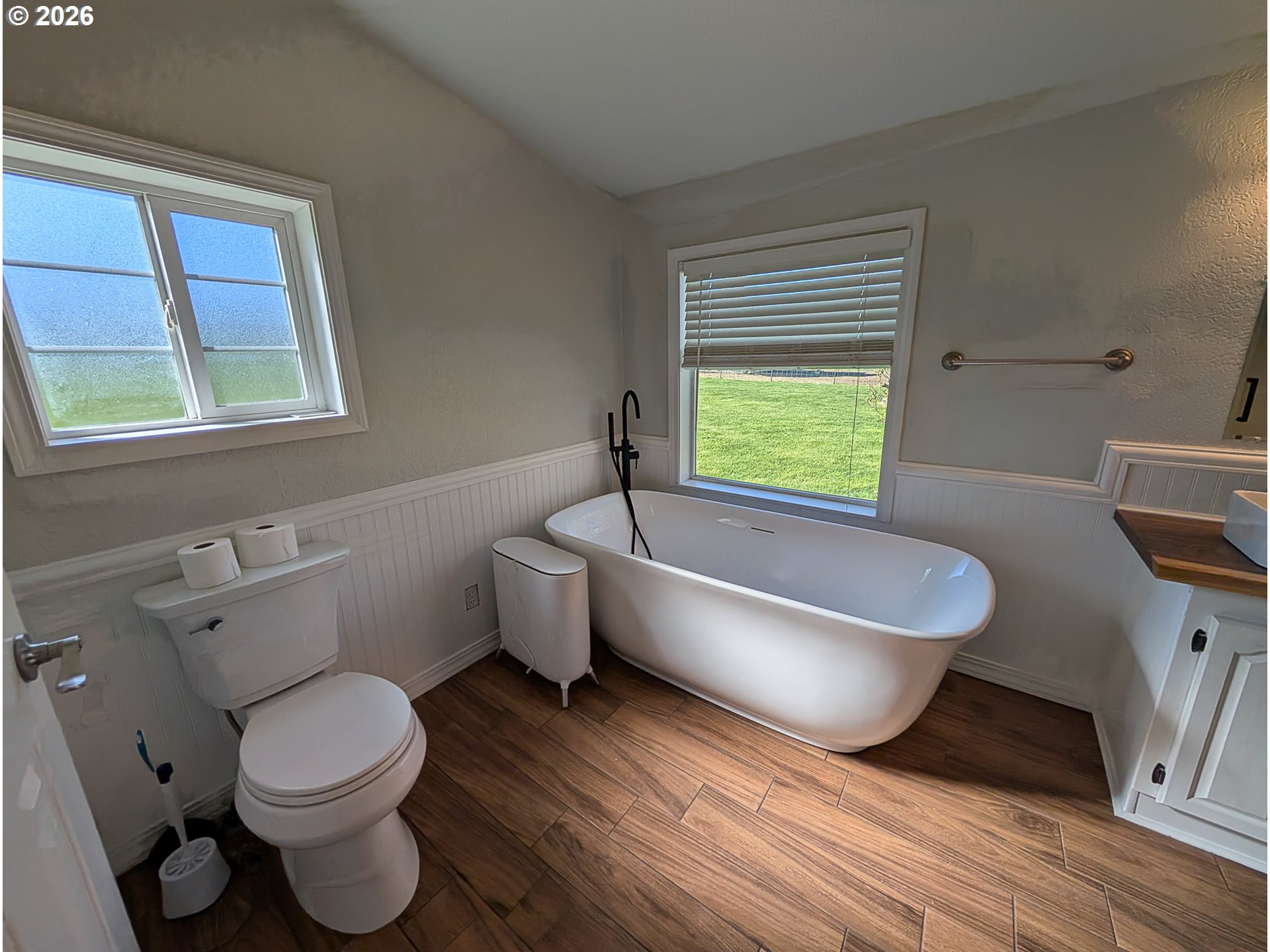 1670 Palmer Street Elgin, OR 97827 - Photo 22 of 41 a bathroom with a toilet a sink and a bathtub
