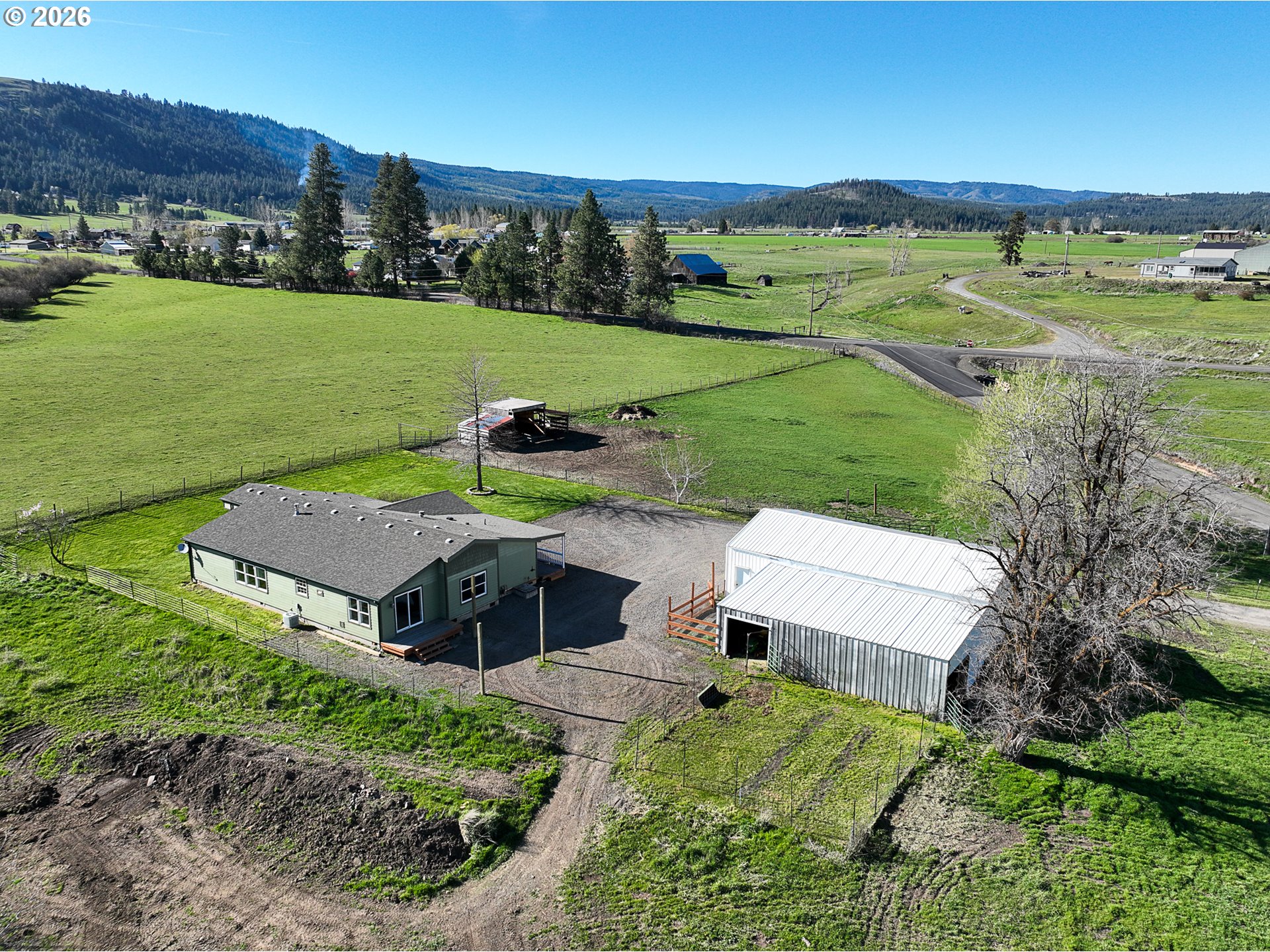 1670 Palmer Street Elgin, OR 97827 - Photo 4 of 41 an aerial view of a house with garden space and outdoor seating