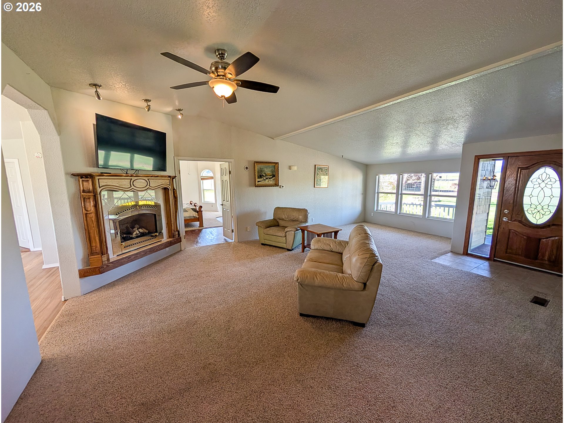 1670 Palmer Street Elgin, OR 97827 - Photo 10 of 41 a living room with furniture and a fireplace