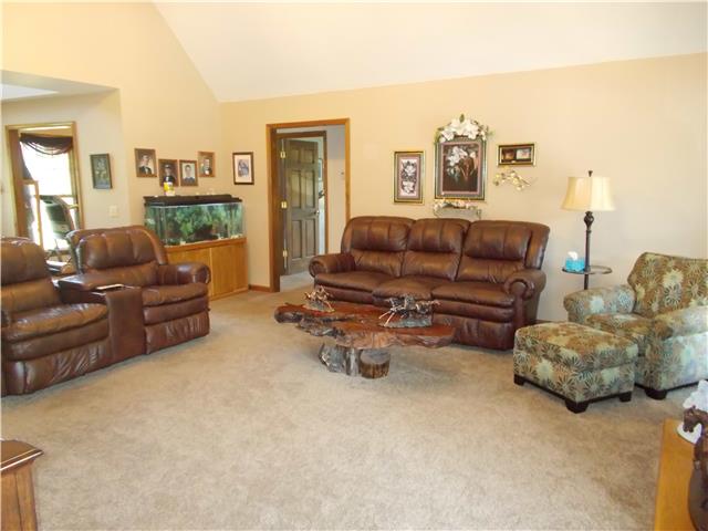 Soaring cathedral ceilings, one of the main focal points of this home.  It overlooks the pool area and lake!