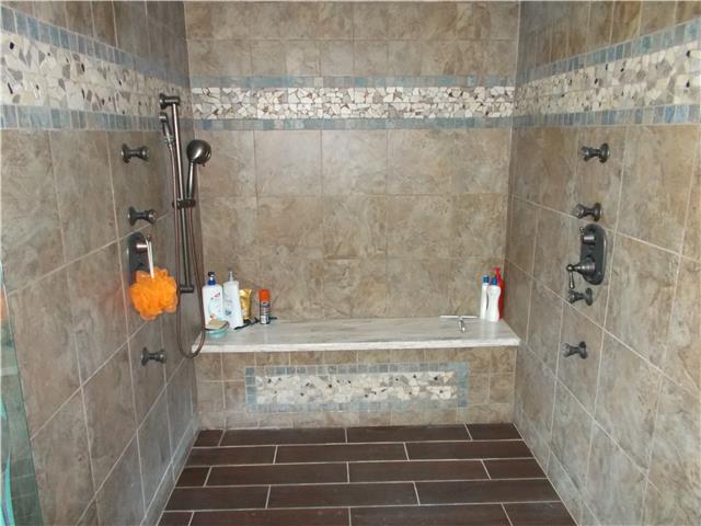 102 Locker Road Summertown, TN 38483 - Photo 9 of 10 Custom decorated tile, two head shower! Bench for relaxing!