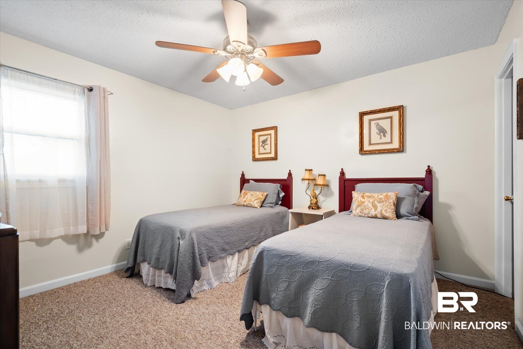 4570 Benson Road Mobile, AL 36619 - Photo 18 of 34 Carpeted bedroom featuring a textured ceiling and ceiling fan