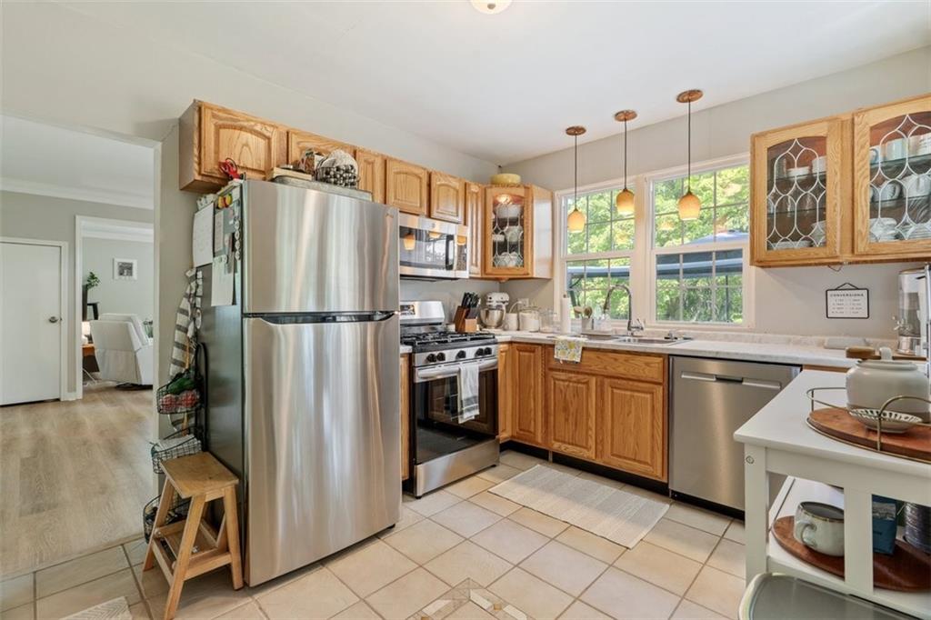 694 Oak Street Crescent, PA 15046 - Photo 17 of 19 a kitchen with a refrigerator and a sink