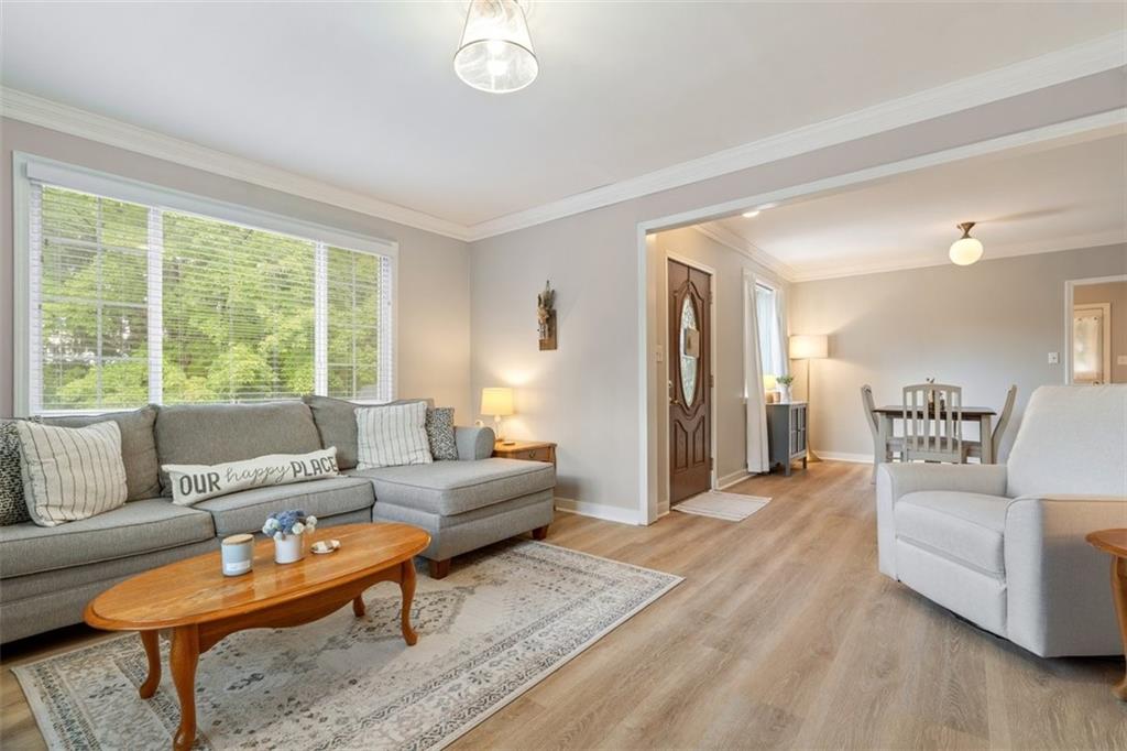 694 Oak Street Crescent, PA 15046 - Photo 7 of 19 a living room with furniture and a large window