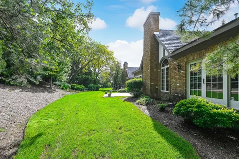 a view of a house with a yard and plants