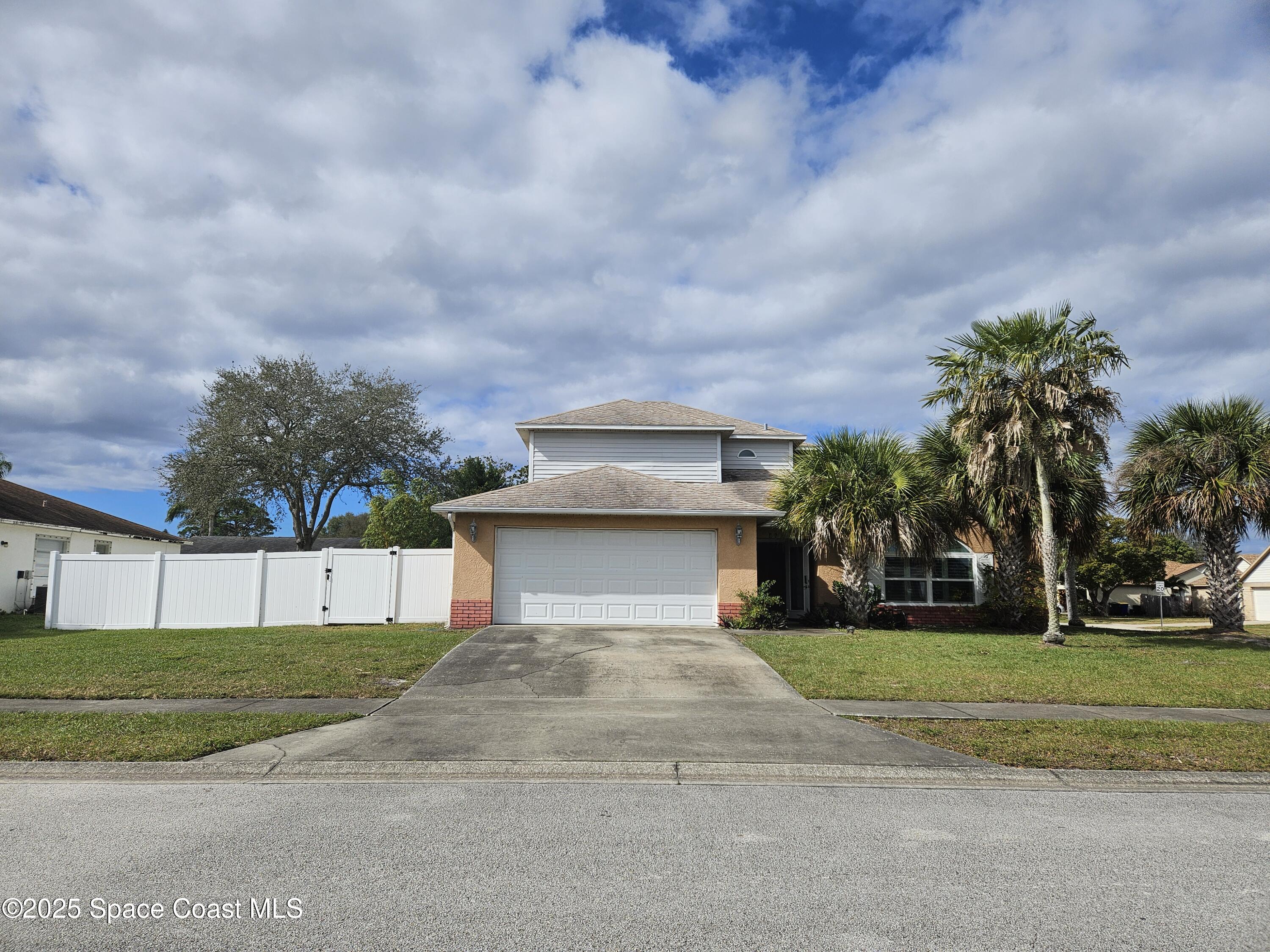 813 Pine Shadows Avenue Rockledge, FL 32955 - Photo 1 of 32 a view of a house with a big yard and large trees