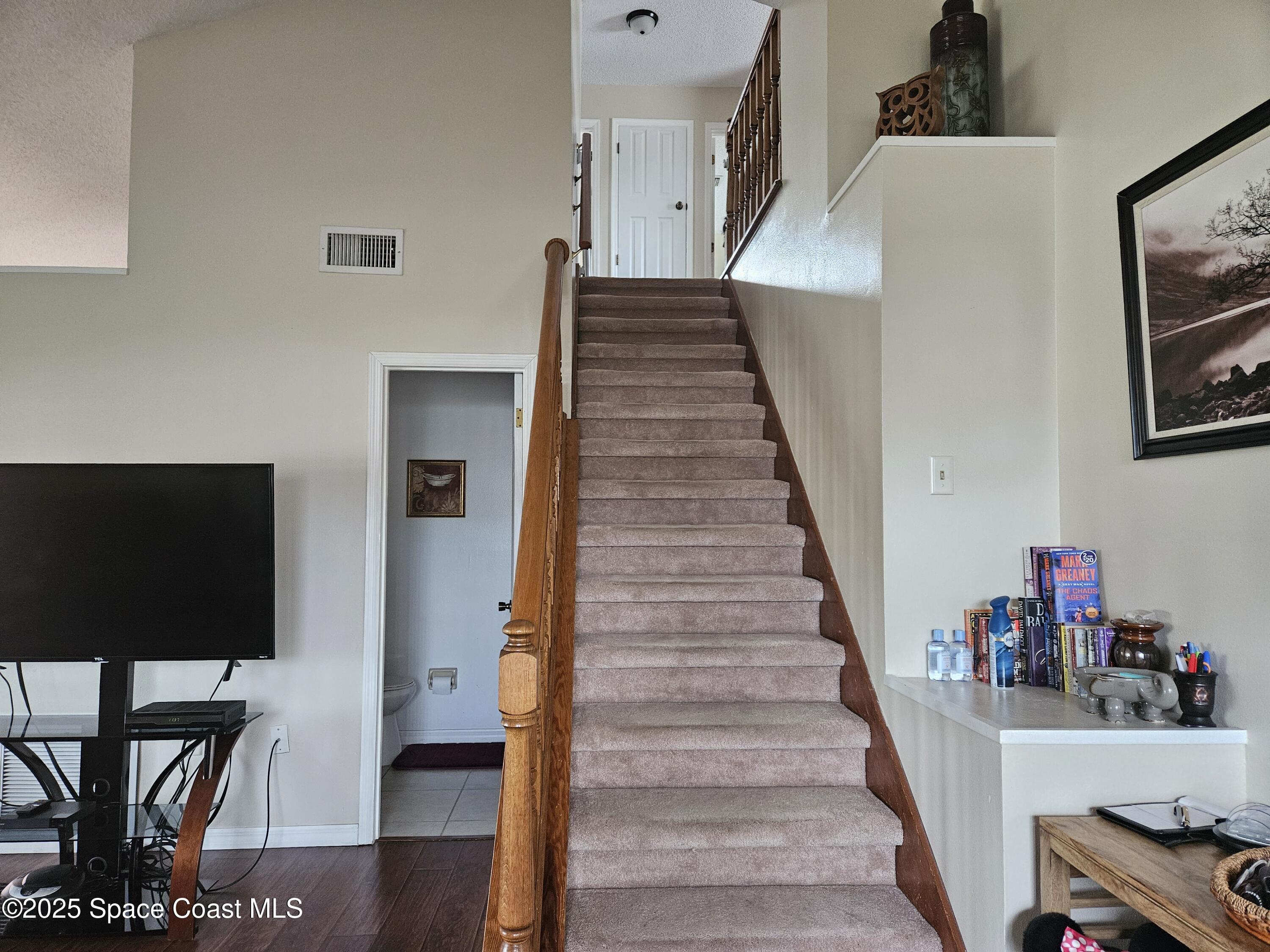 813 Pine Shadows Avenue Rockledge, FL 32955 - Photo 18 of 32 a view of entryway and hall with wooden floor