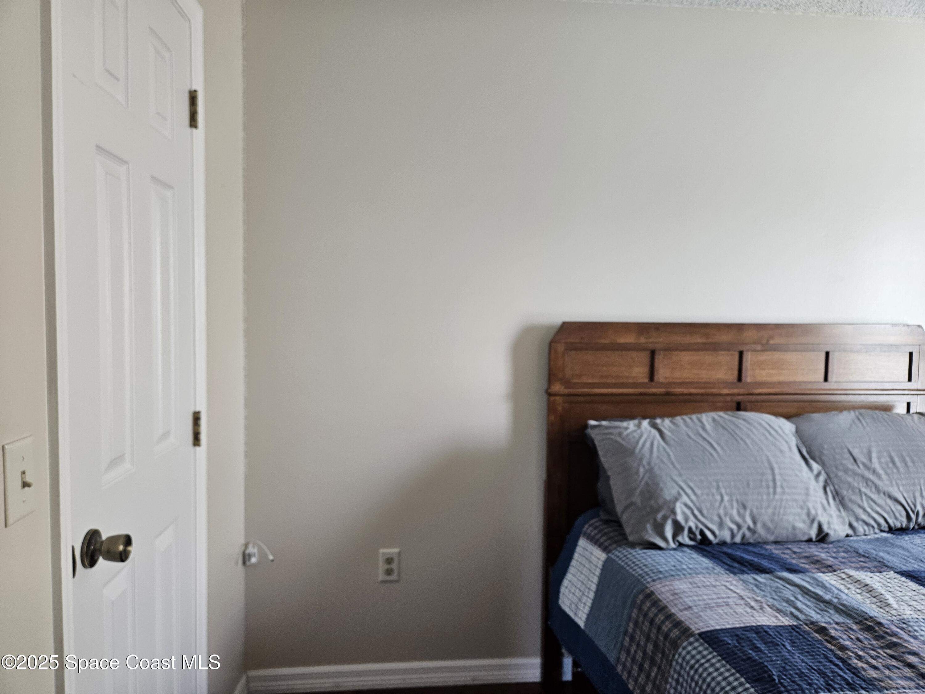 813 Pine Shadows Avenue Rockledge, FL 32955 - Photo 25 of 32 a view of utility room with wooden floor