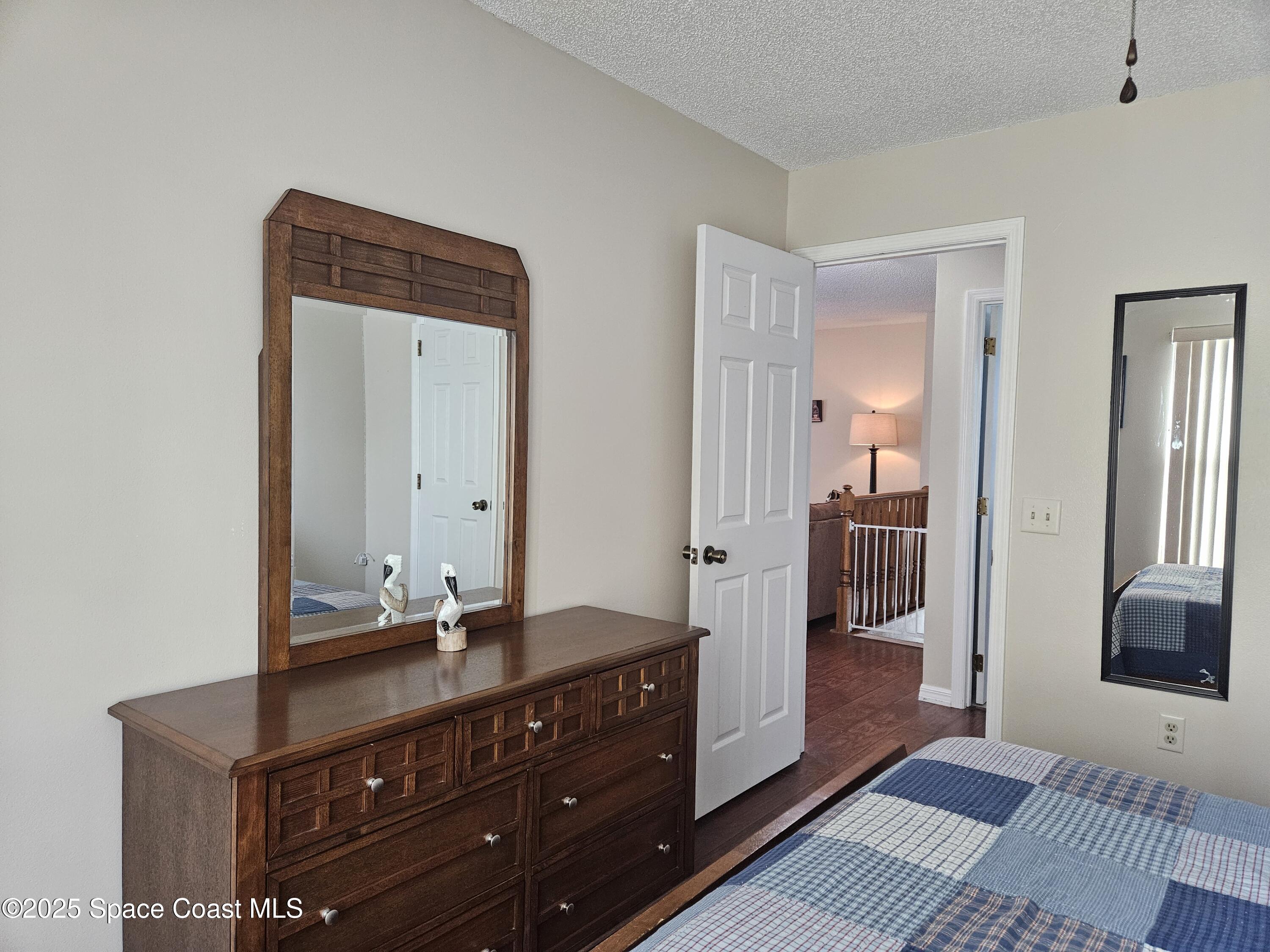 813 Pine Shadows Avenue Rockledge, FL 32955 - Photo 26 of 32 a bathroom with a sink and a mirror