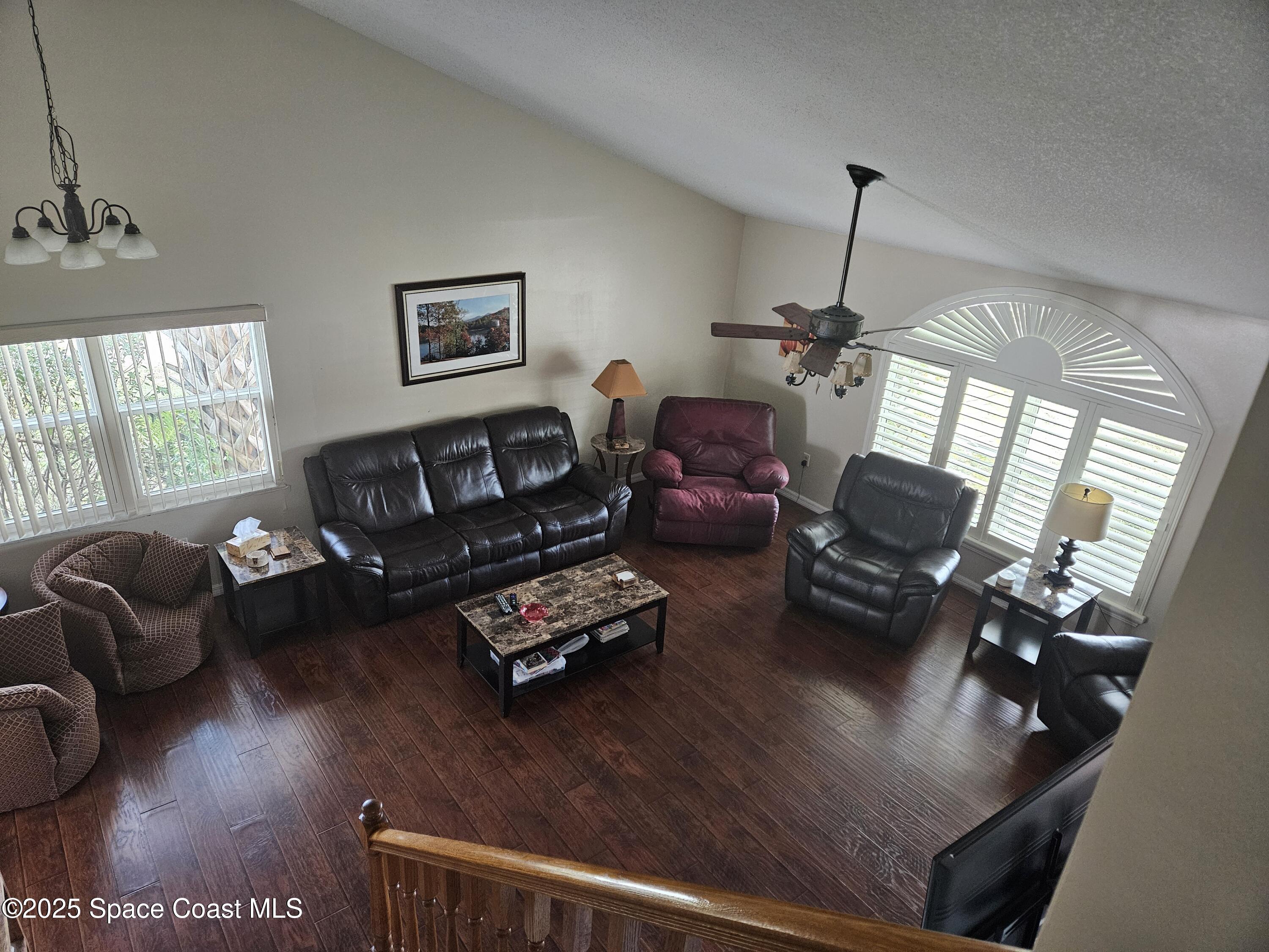 813 Pine Shadows Avenue Rockledge, FL 32955 - Photo 28 of 32 a living room with furniture window and wooden floor