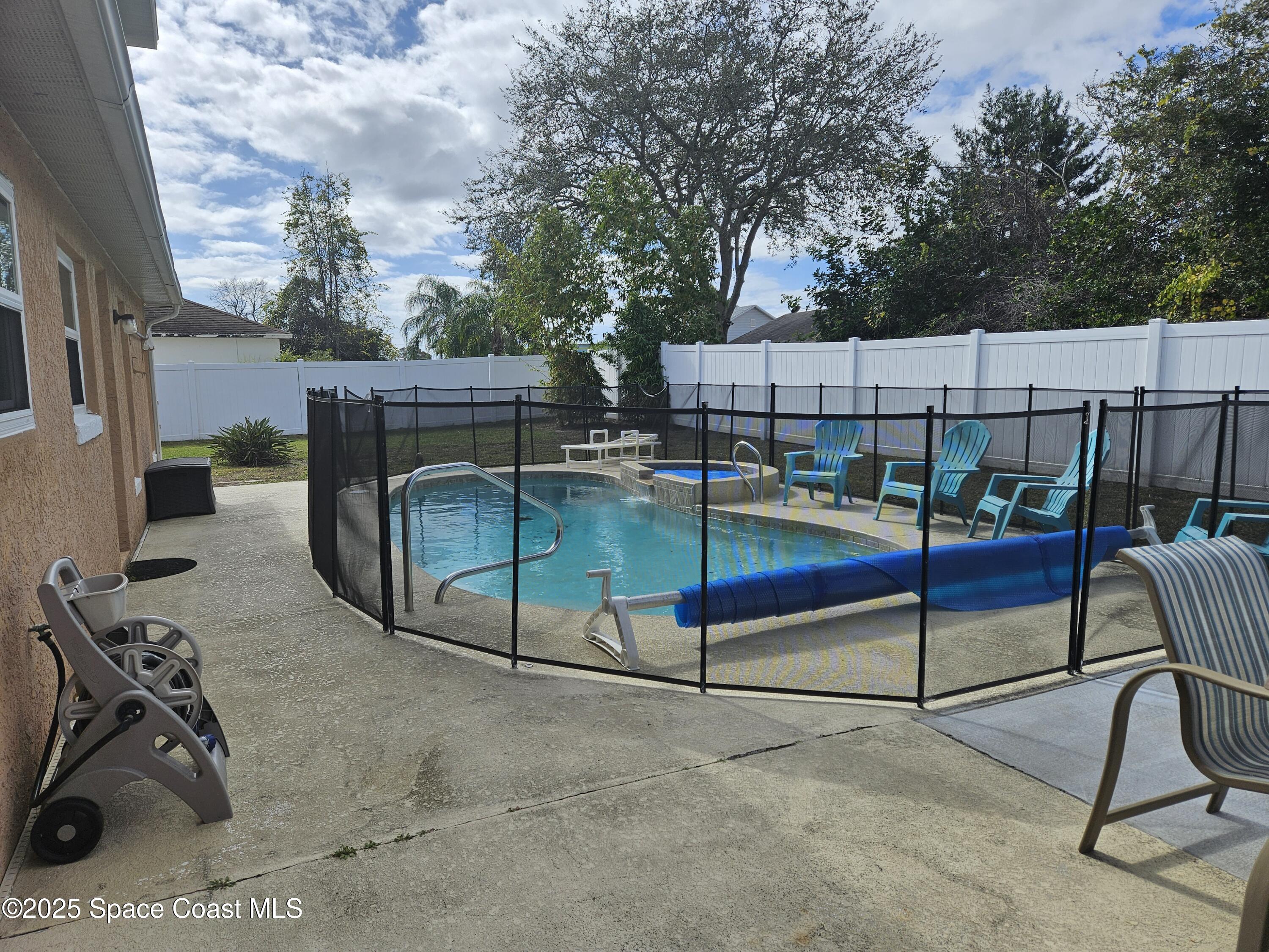 813 Pine Shadows Avenue Rockledge, FL 32955 - Photo 29 of 32 a view of a backyard with a slide