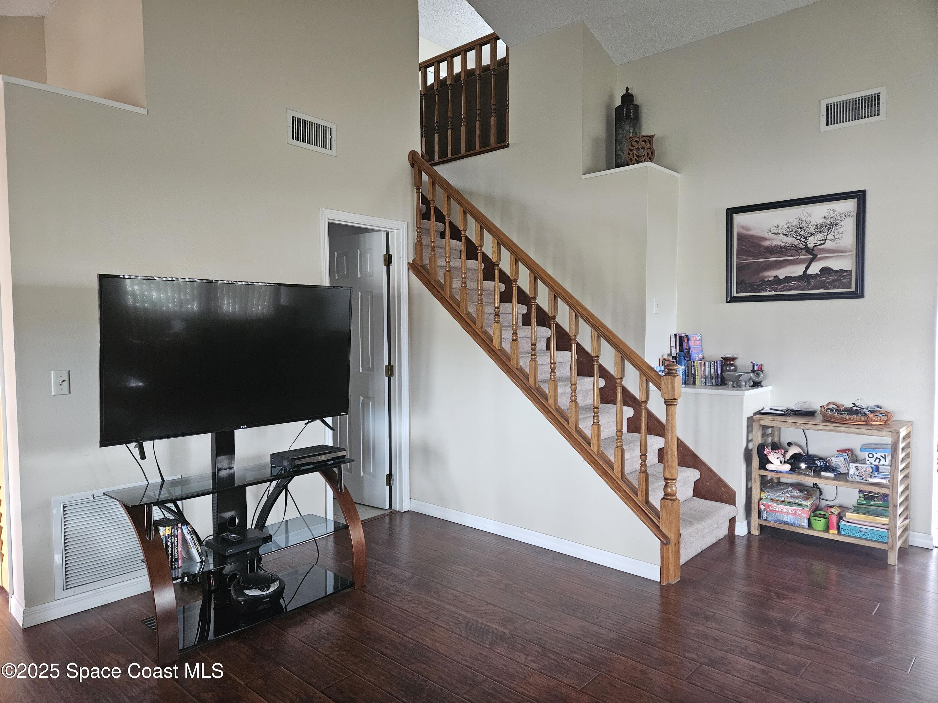 813 Pine Shadows Avenue Rockledge, FL 32955 - Photo 10 of 32 a view of a livingroom with furniture and hardwood floor