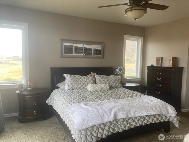 a bedroom with a bed and window