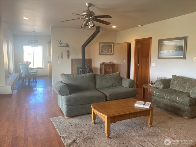 a view of living room with furniture and floor to ceiling window