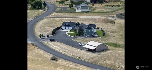 a view of a house with a big yard