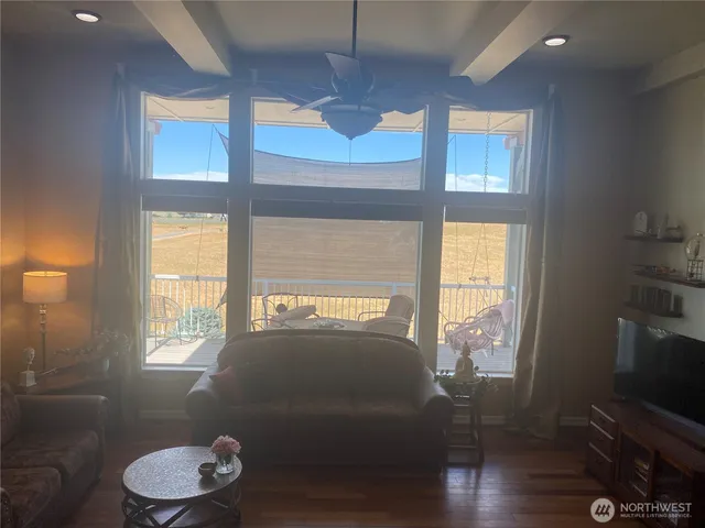 a living room with furniture and a window