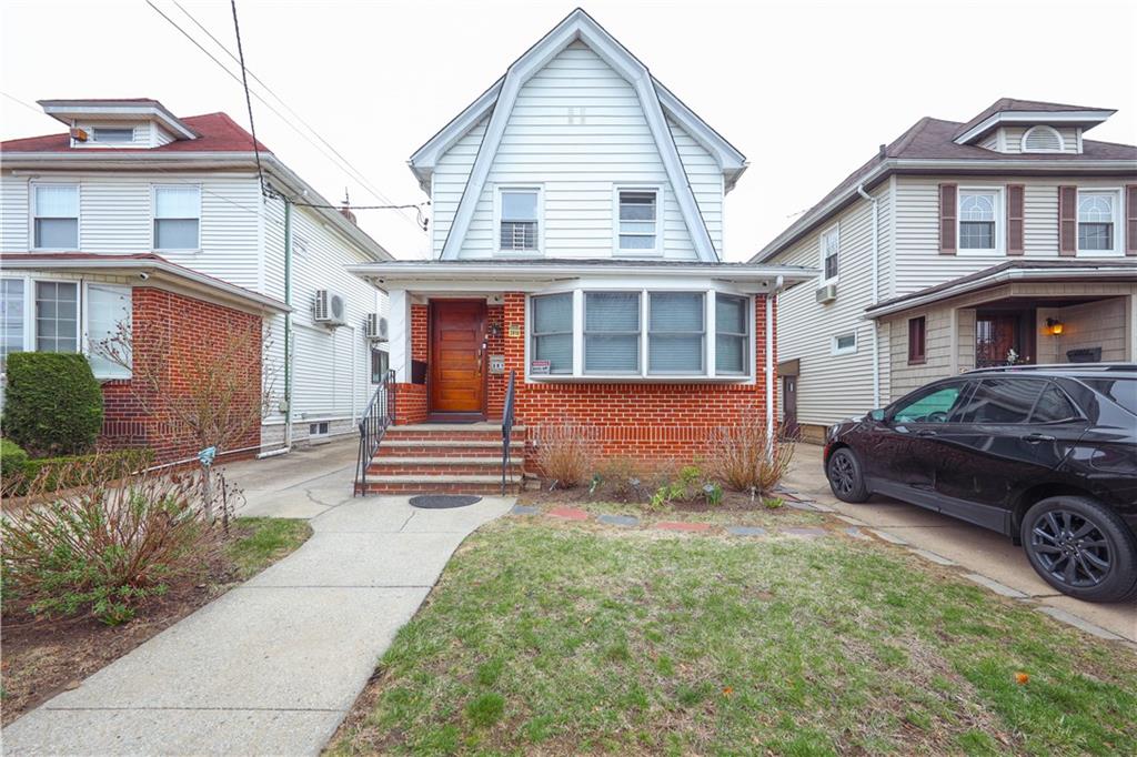 2810 Avenue R Brooklyn, NY 11229 - Photo 1 of 1 a front view of a house with a yard and garage