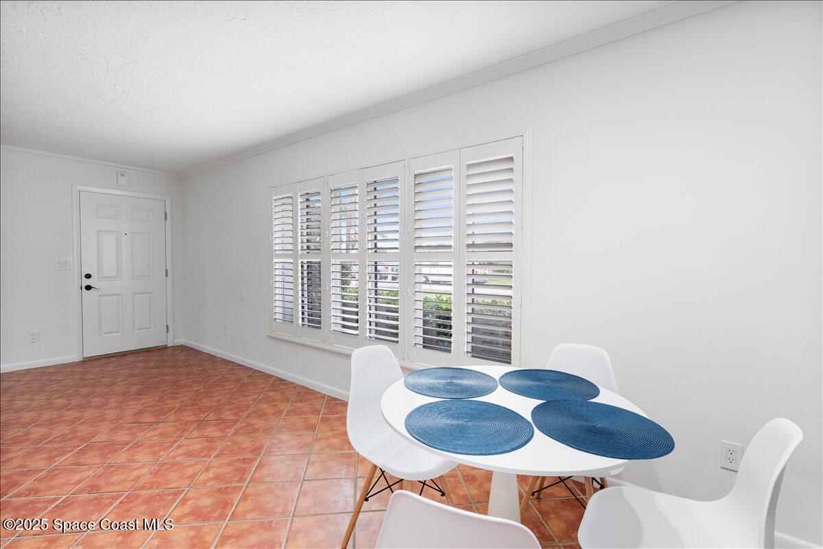 2175 Barracuda Avenue Melbourne Beach, FL 32951 - Photo 12 of 49 a living room with furniture and a window
