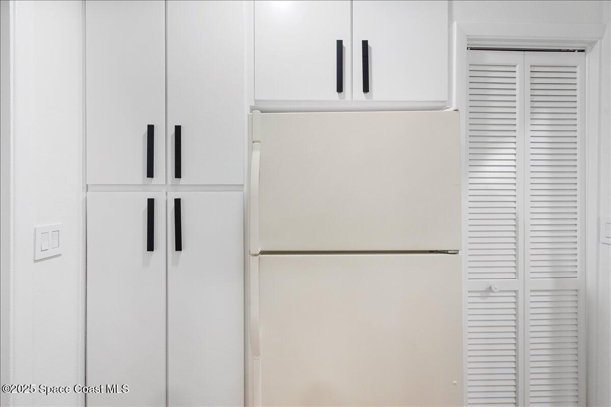 2175 Barracuda Avenue Melbourne Beach, FL 32951 - Photo 17 of 49 a white refrigerator freezer and a window