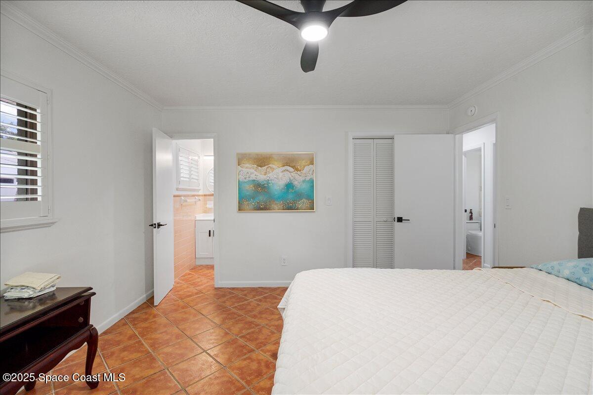 2175 Barracuda Avenue Melbourne Beach, FL 32951 - Photo 29 of 49 a bedroom with a bed and a window