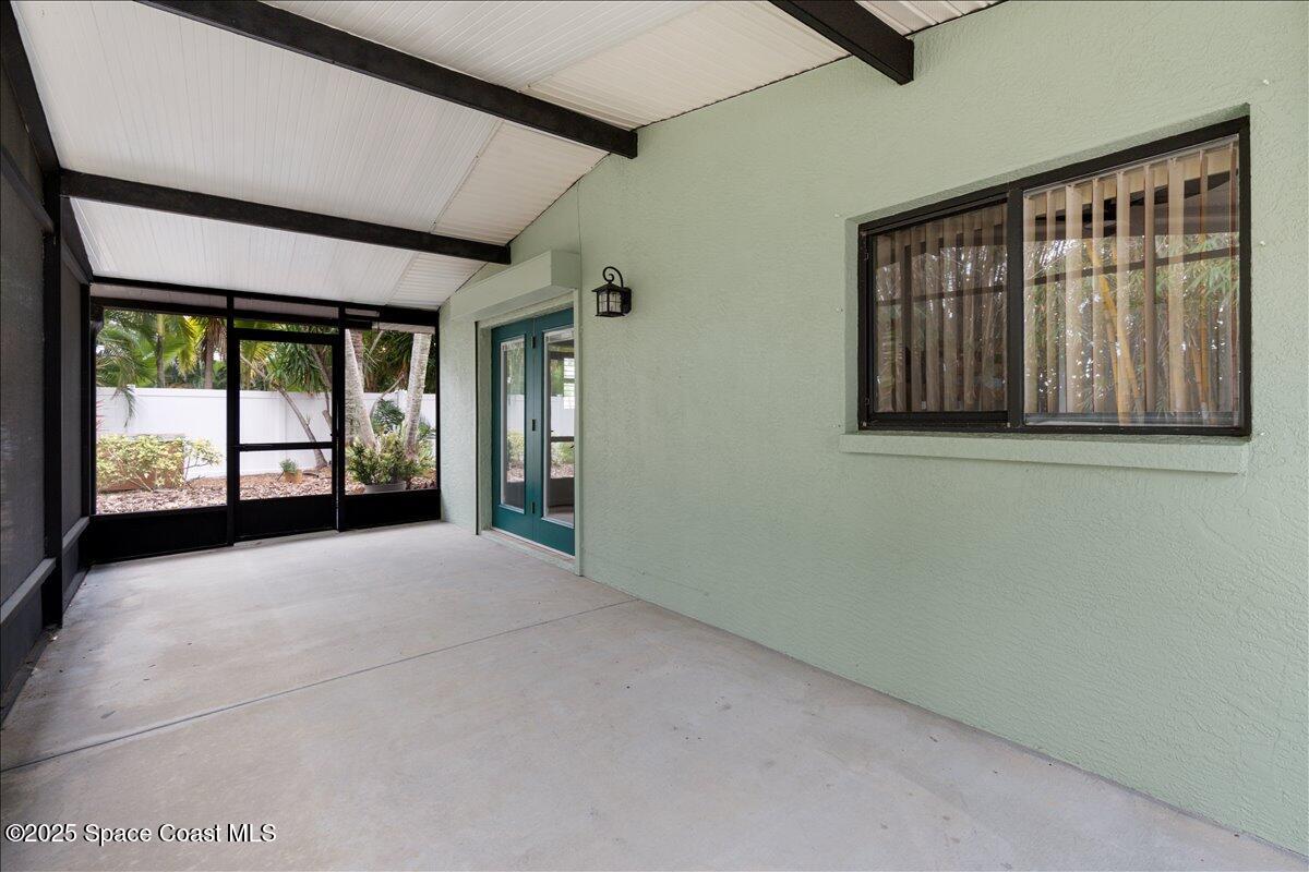 2175 Barracuda Avenue Melbourne Beach, FL 32951 - Photo 38 of 49 a view of an empty room with large windows