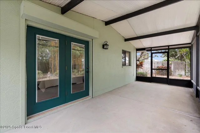 a view of an entryway with a floor to ceiling window