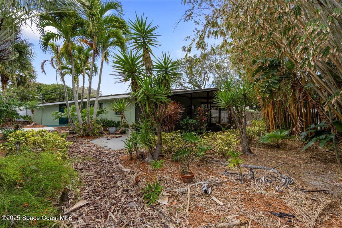 2175 Barracuda Avenue Melbourne Beach, FL 32951 - Photo 42 of 49 a view of a garden