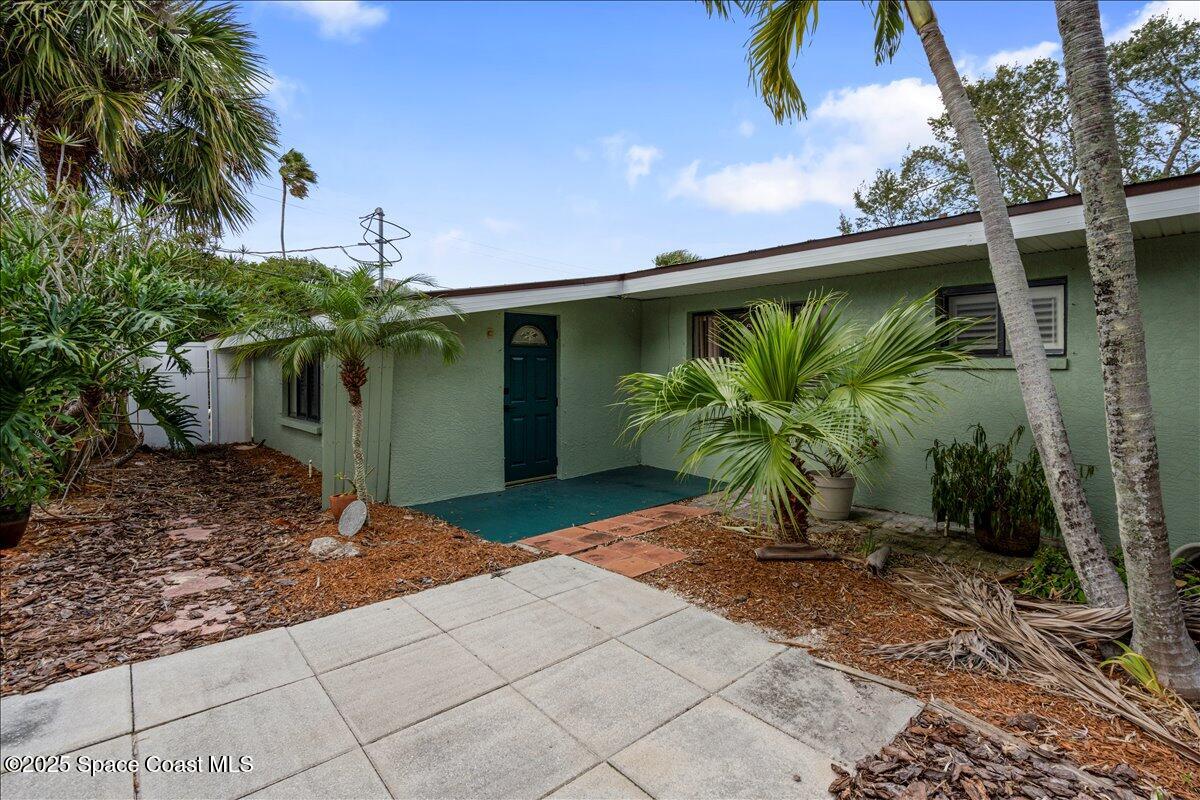 2175 Barracuda Avenue Melbourne Beach, FL 32951 - Photo 43 of 49 a couple of potted plants in front of door