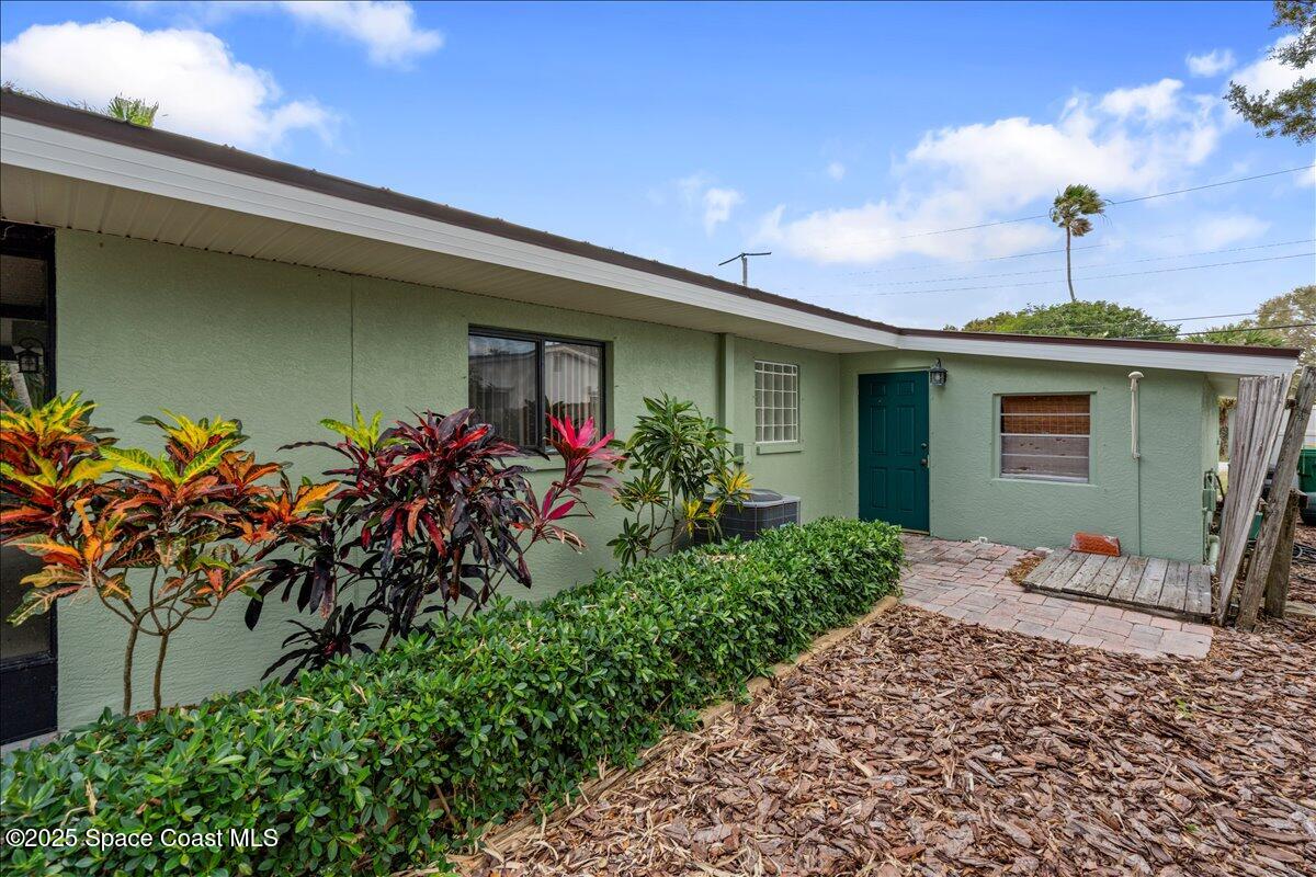 2175 Barracuda Avenue Melbourne Beach, FL 32951 - Photo 45 of 49 a front view of a house with a yard